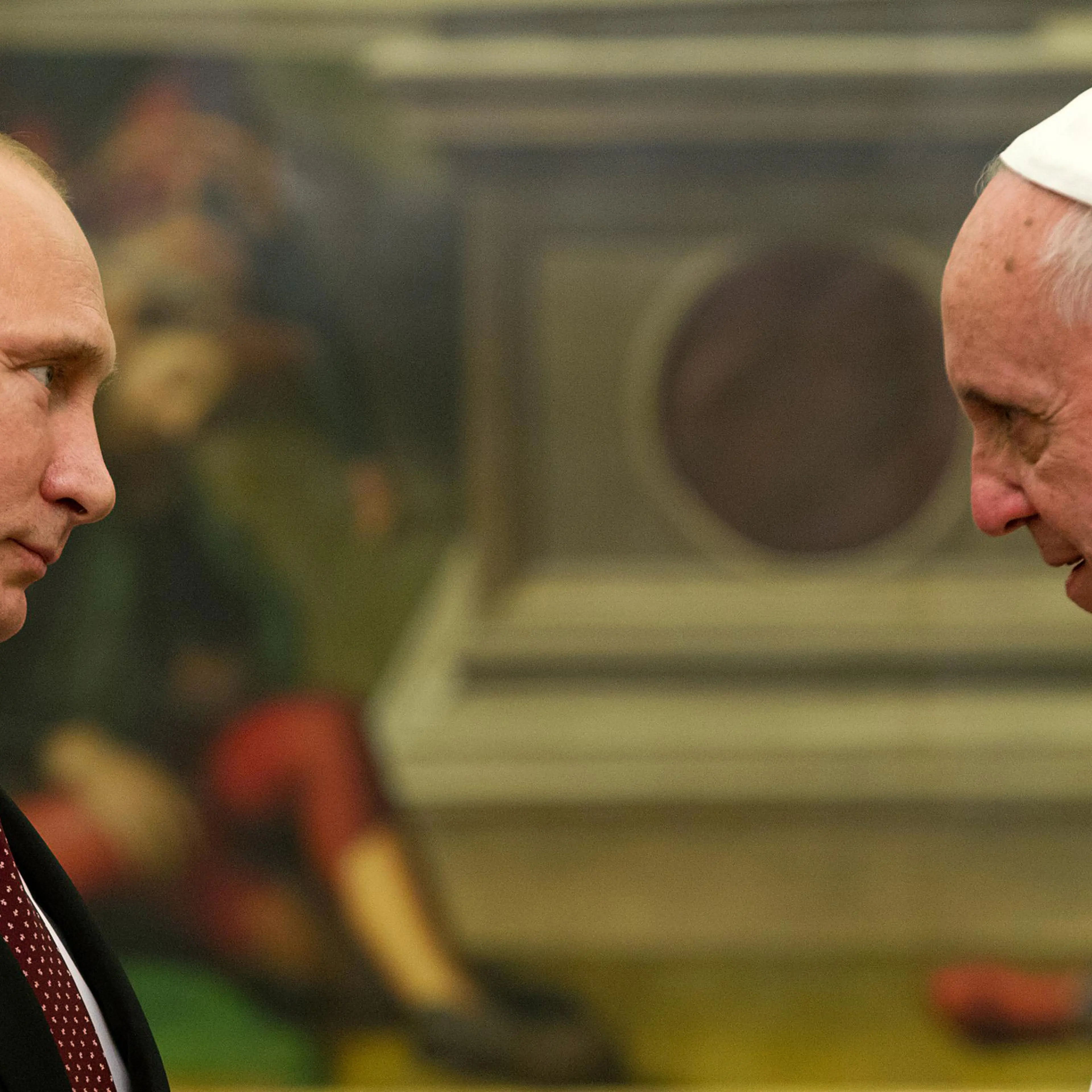Pope Francis speaks to Russian President Vladimir Putin, left, on the occasion of their private audience at the Vatican on Nov. 25, 2013.