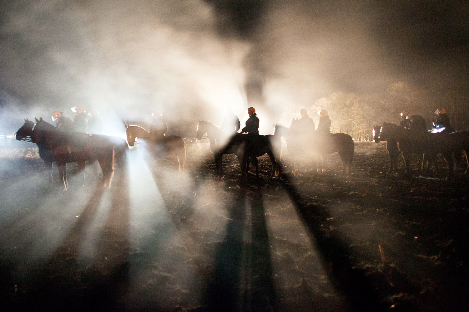 November 28, 2011. Police watch anti-nuclear protesters demonstrating in Laase, Germany, a point along the route of a train bearing nuclear waste from La Hague, France, to Gorleben, Germany, in a record- setting 125-hour journey. 

