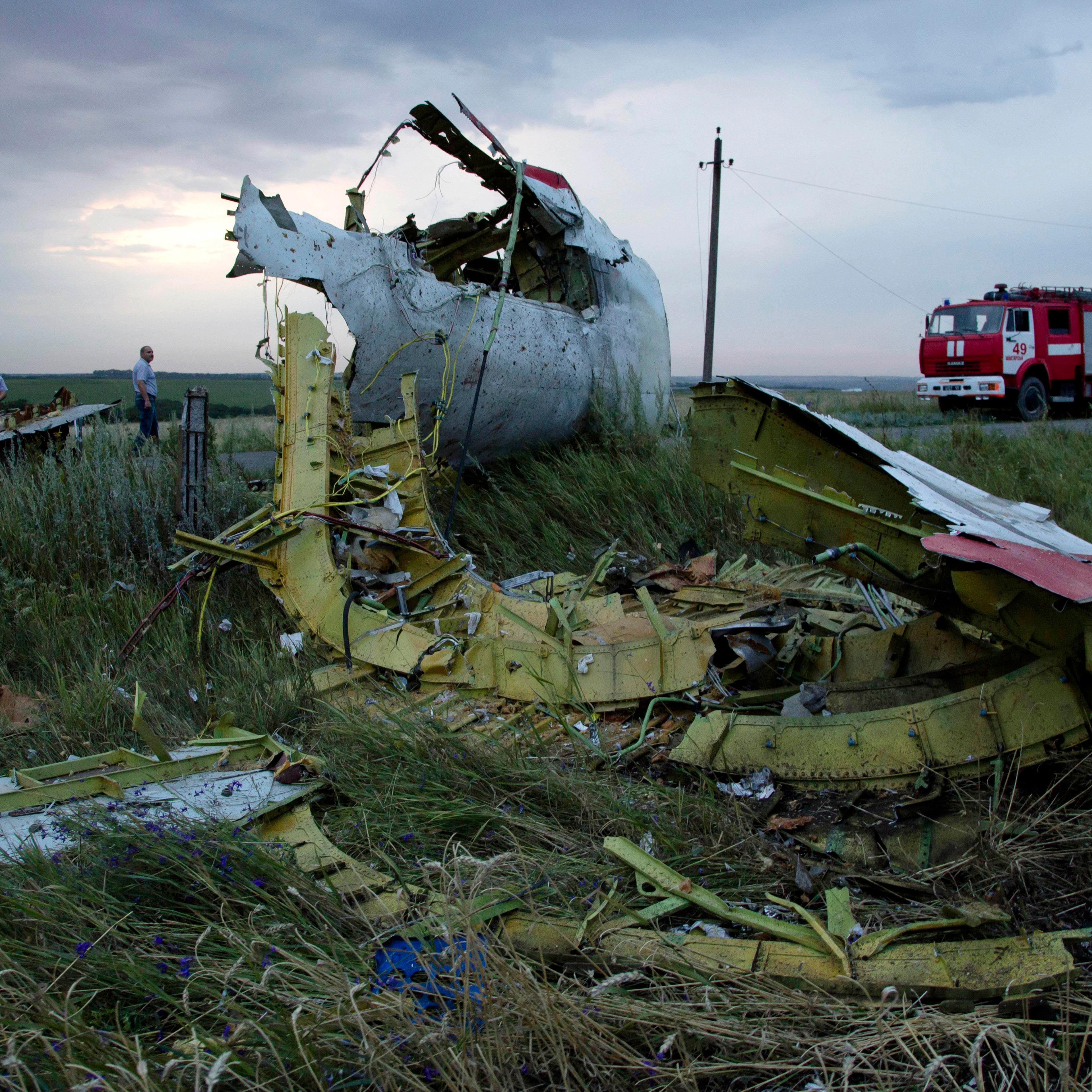 Firefighters arrive at the crash site of Malaysia Airlines Flight 17 near the village of Hrabove, Ukraine, on July 17, 2014.