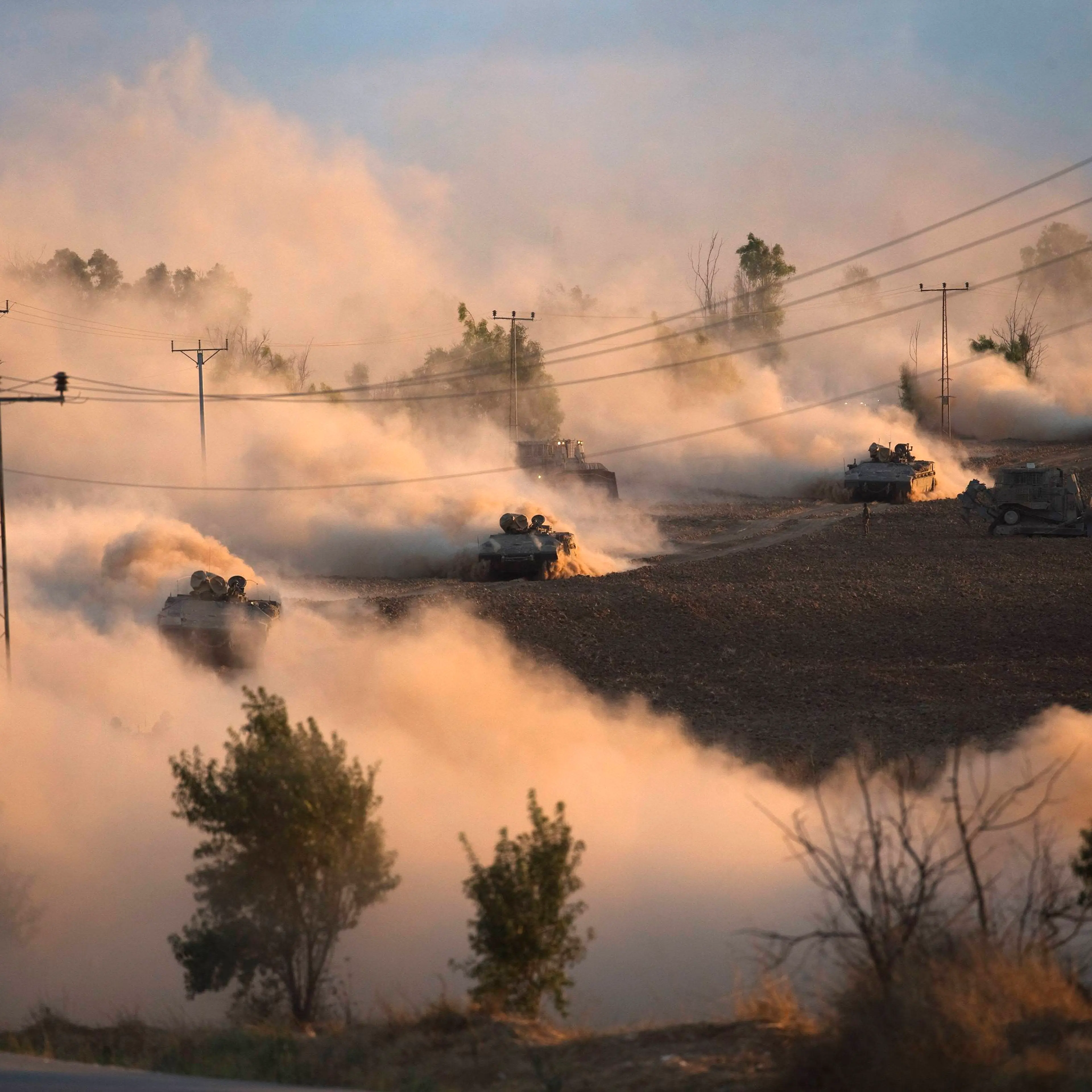 Israeli tanks maneuver outside the Gaza Strip on July 18, 2014.