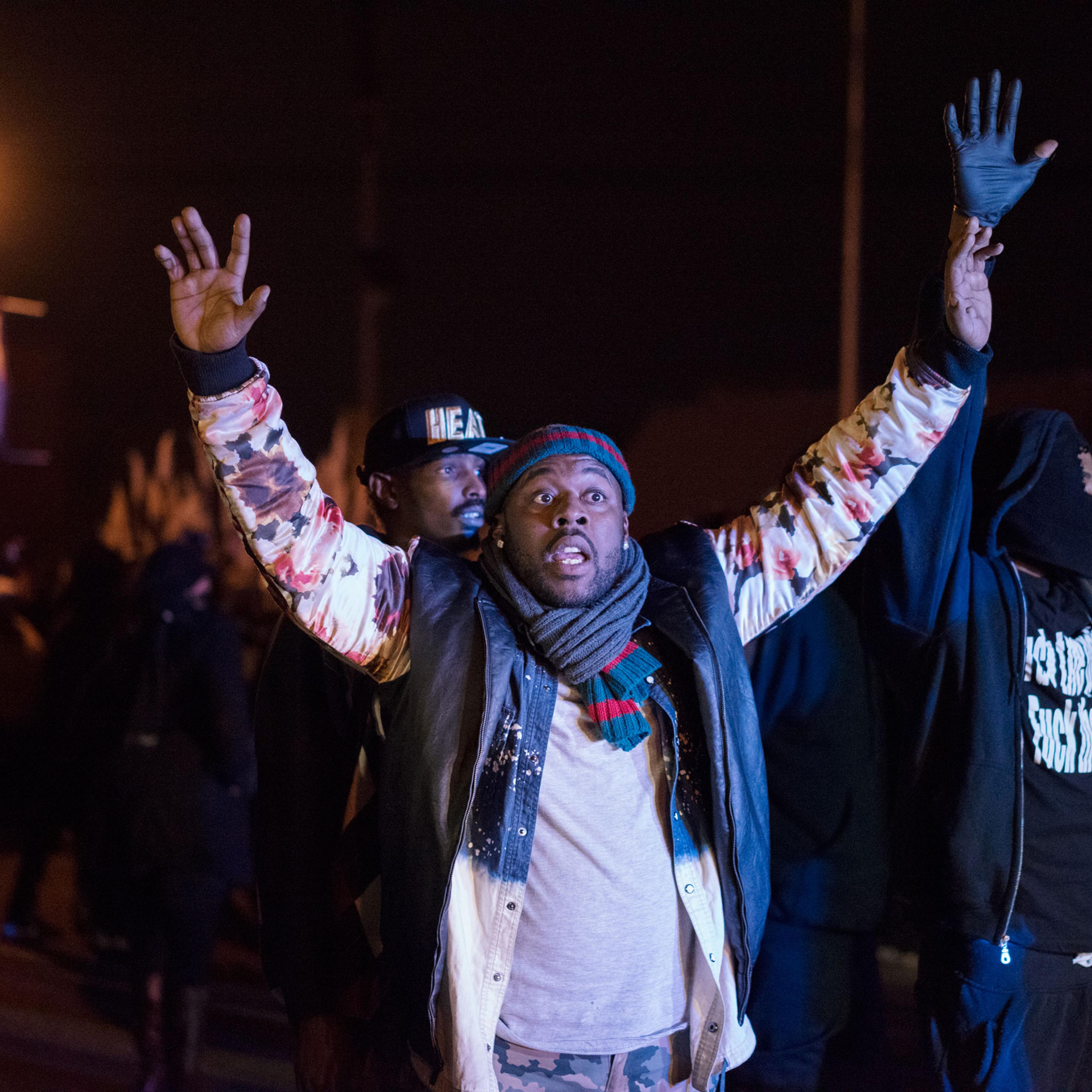 A demonstrator puts his hands in the air amid protests in Ferguson, Mo. on Nov. 24, 2014