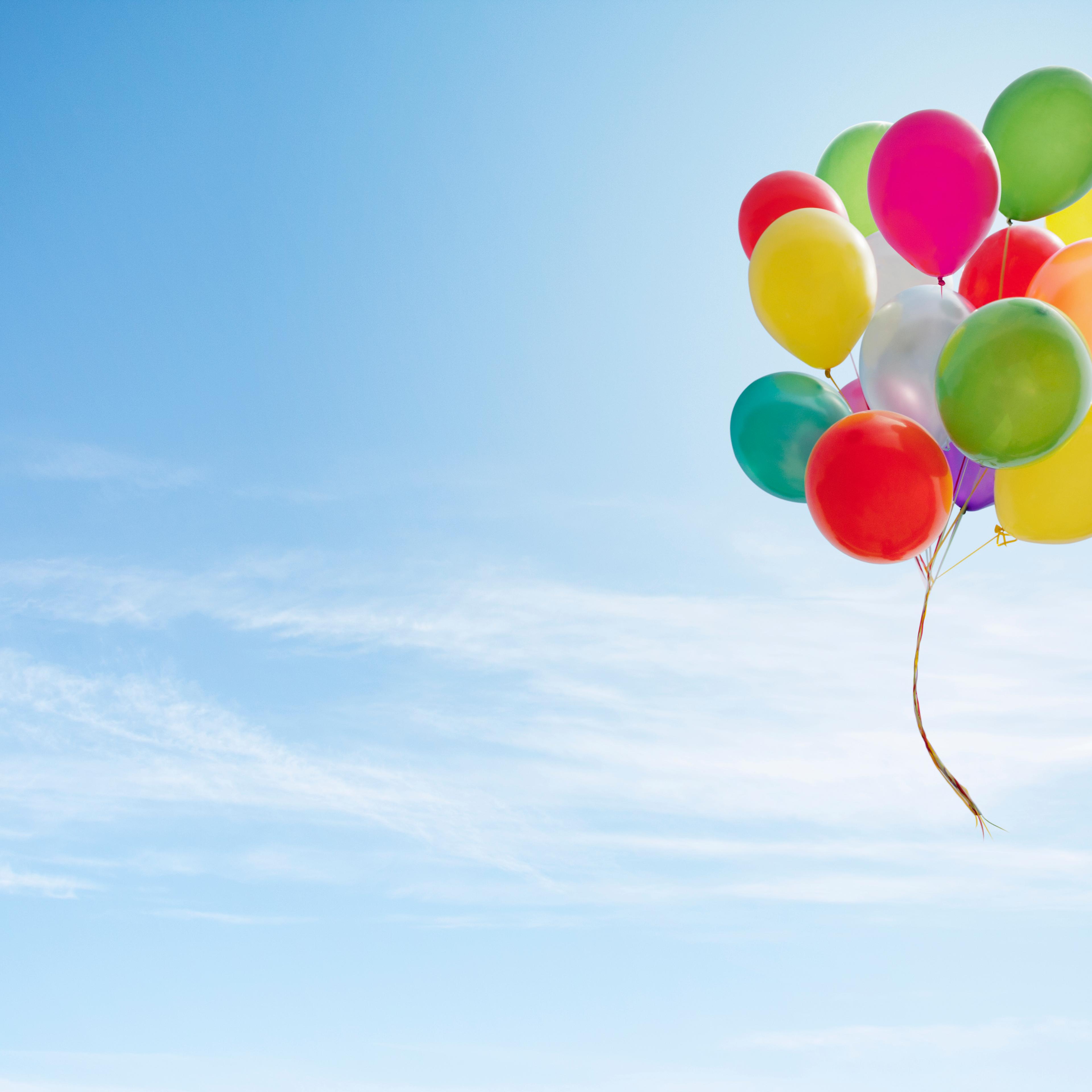 Colorful bunch of balloons floating in the sky