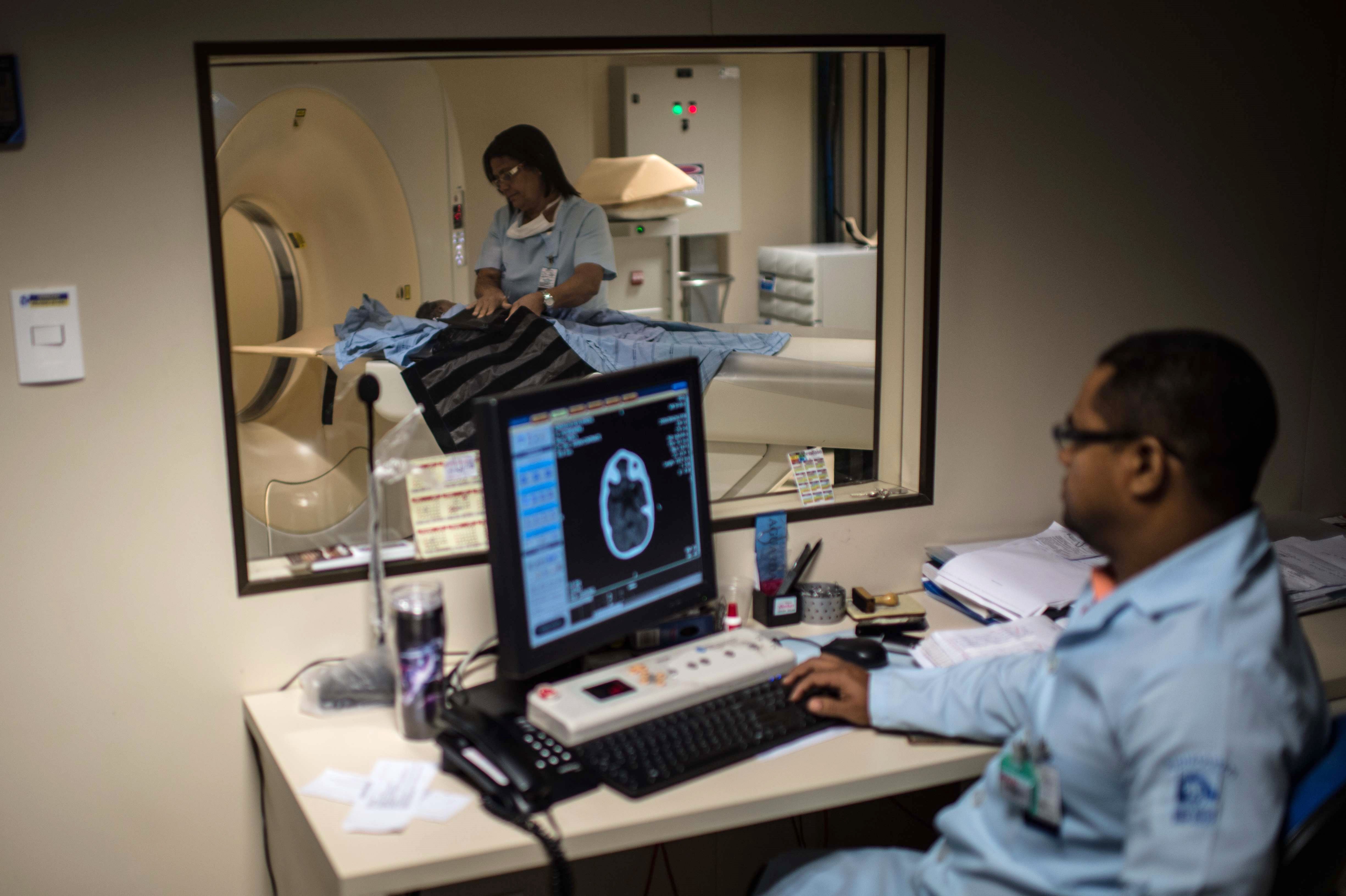 Doctors scan the brain of a newborn to detect microcephaly, a neurological disorder associated with the Zika virus, at the Obras Sociais Irma Dulce hospital in Salvador, Brazil, Jan. 27, 2016.