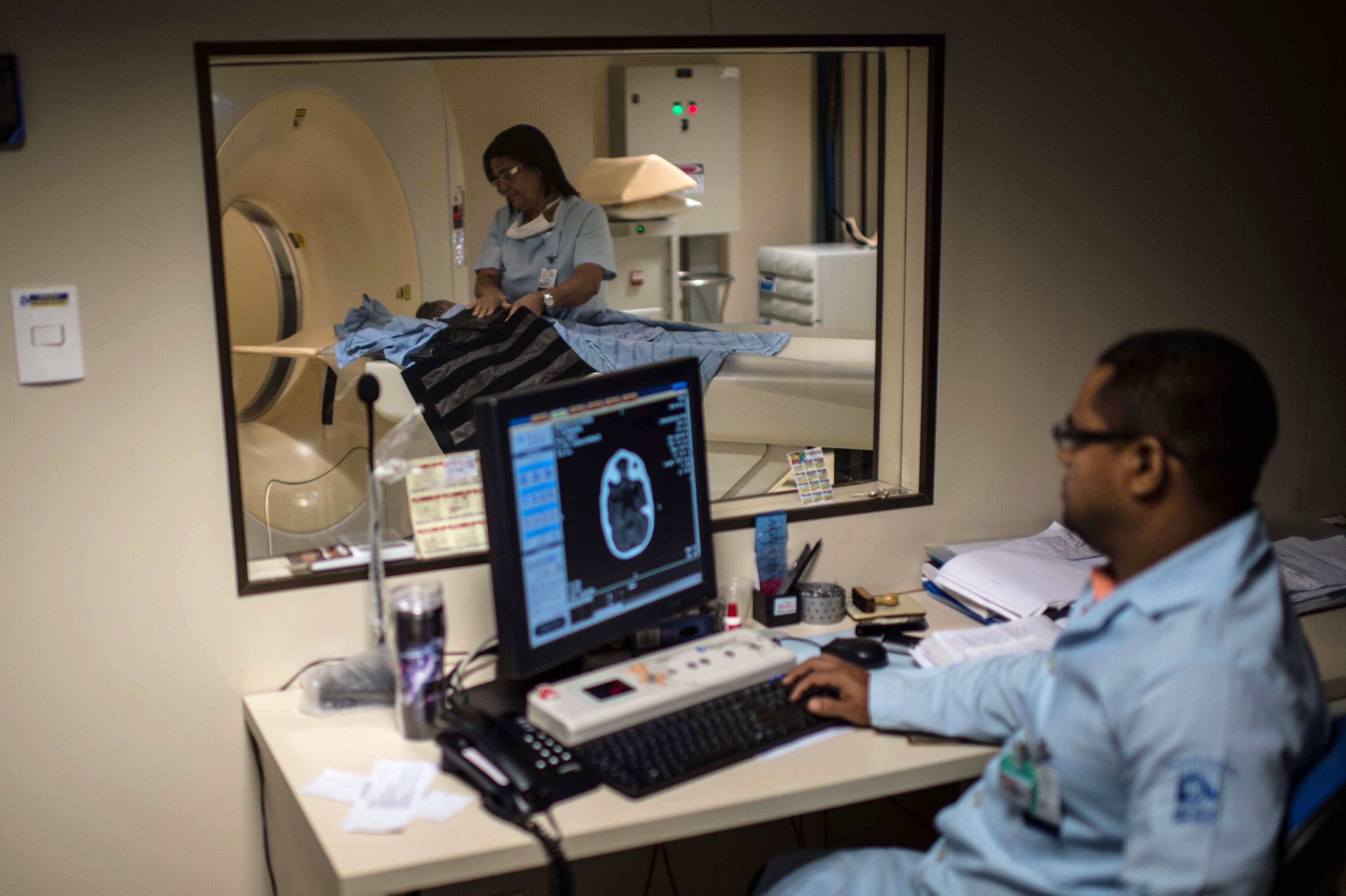 Doctors scan the brain of a newborn to detect microcephaly, a neurological disorder associated with the Zika virus, at the Obras Sociais Irma Dulce hospital in Salvador, Brazil, Jan. 27, 2016.