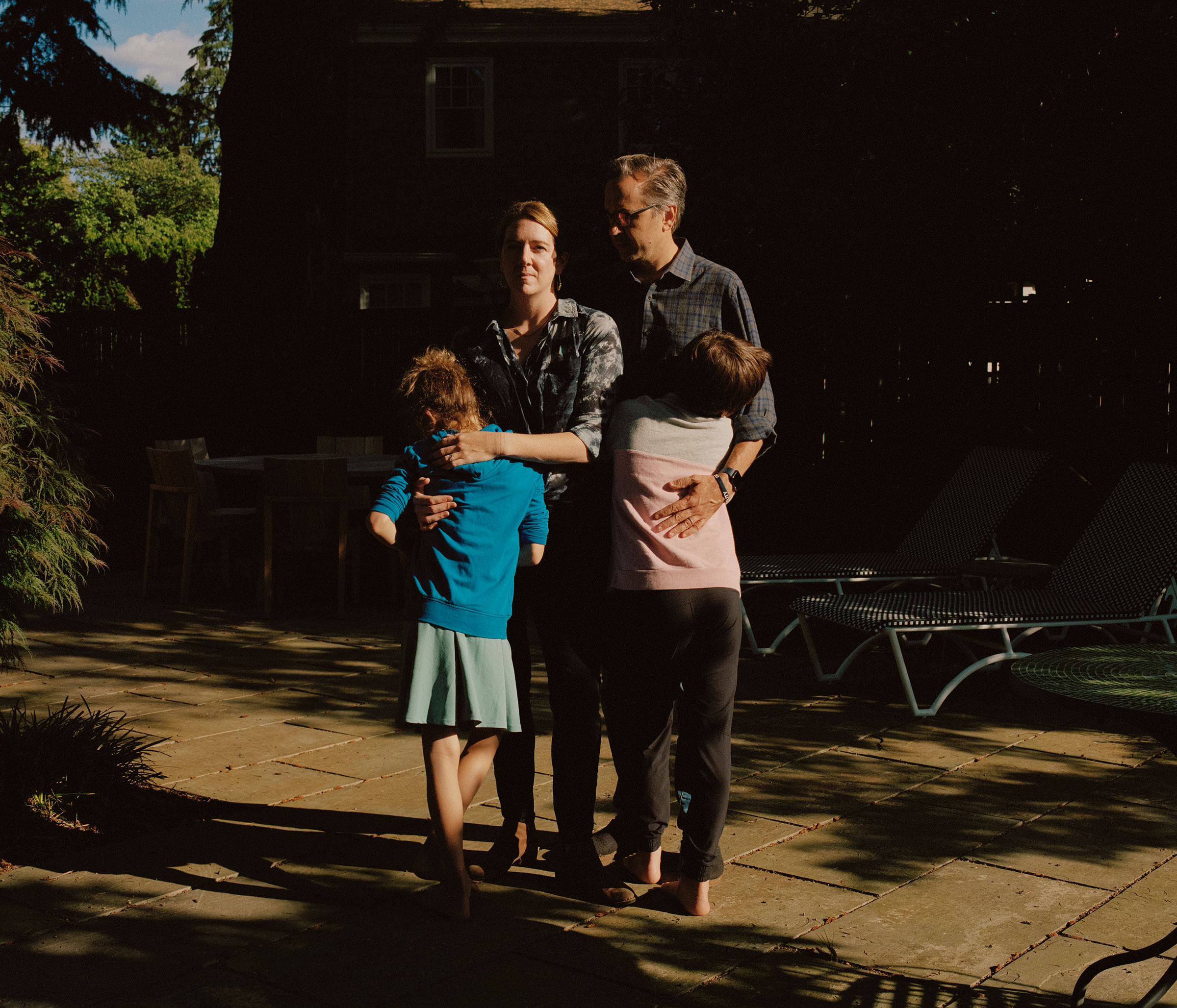 Karen and Chris with their kids at their new home in Portland, Ore. after leaving their home in Austin, Texas because of anti-trans state action.