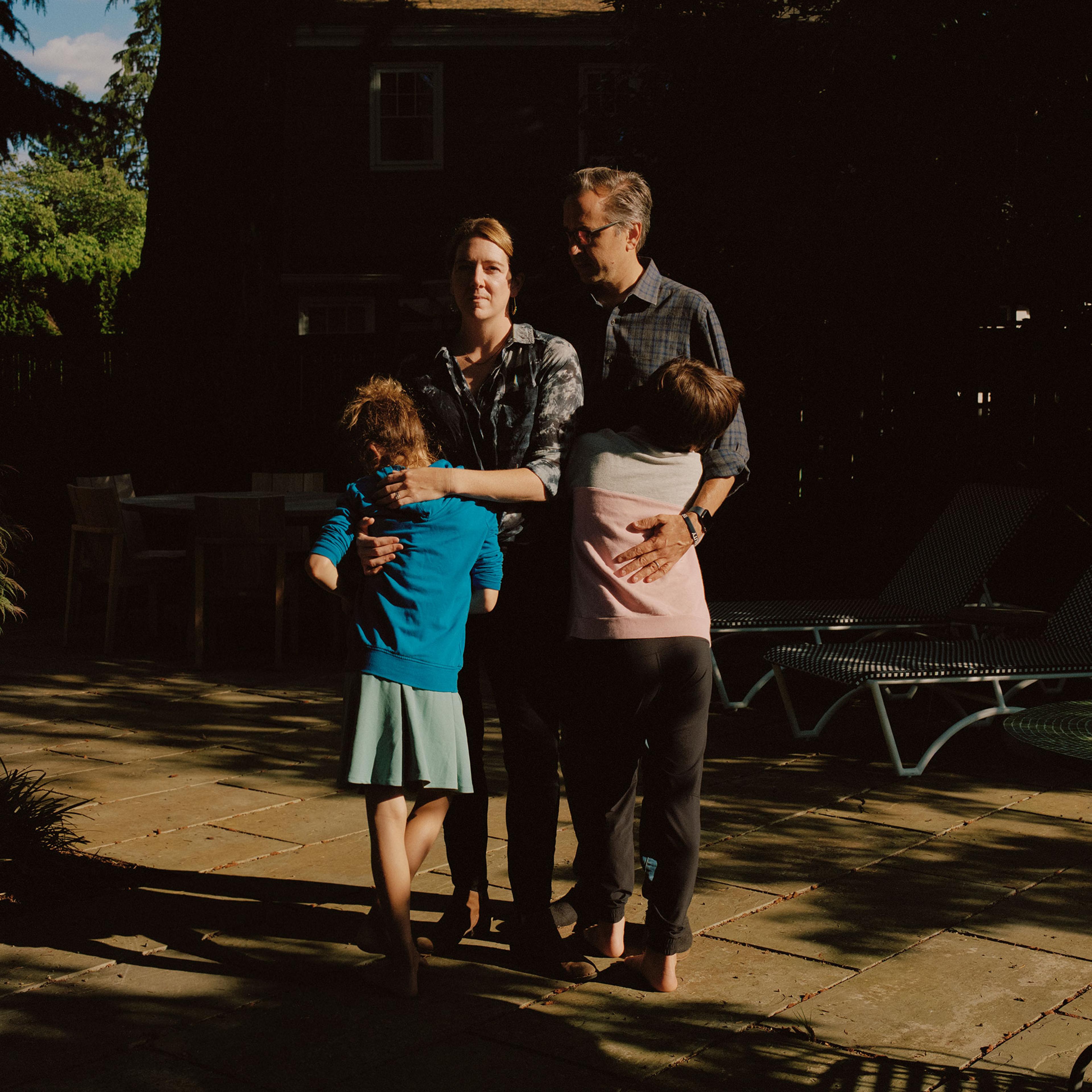 Karen and Chris with their kids at their new home in Portland, Ore. after leaving their home in Austin, Texas because of anti-trans state action.