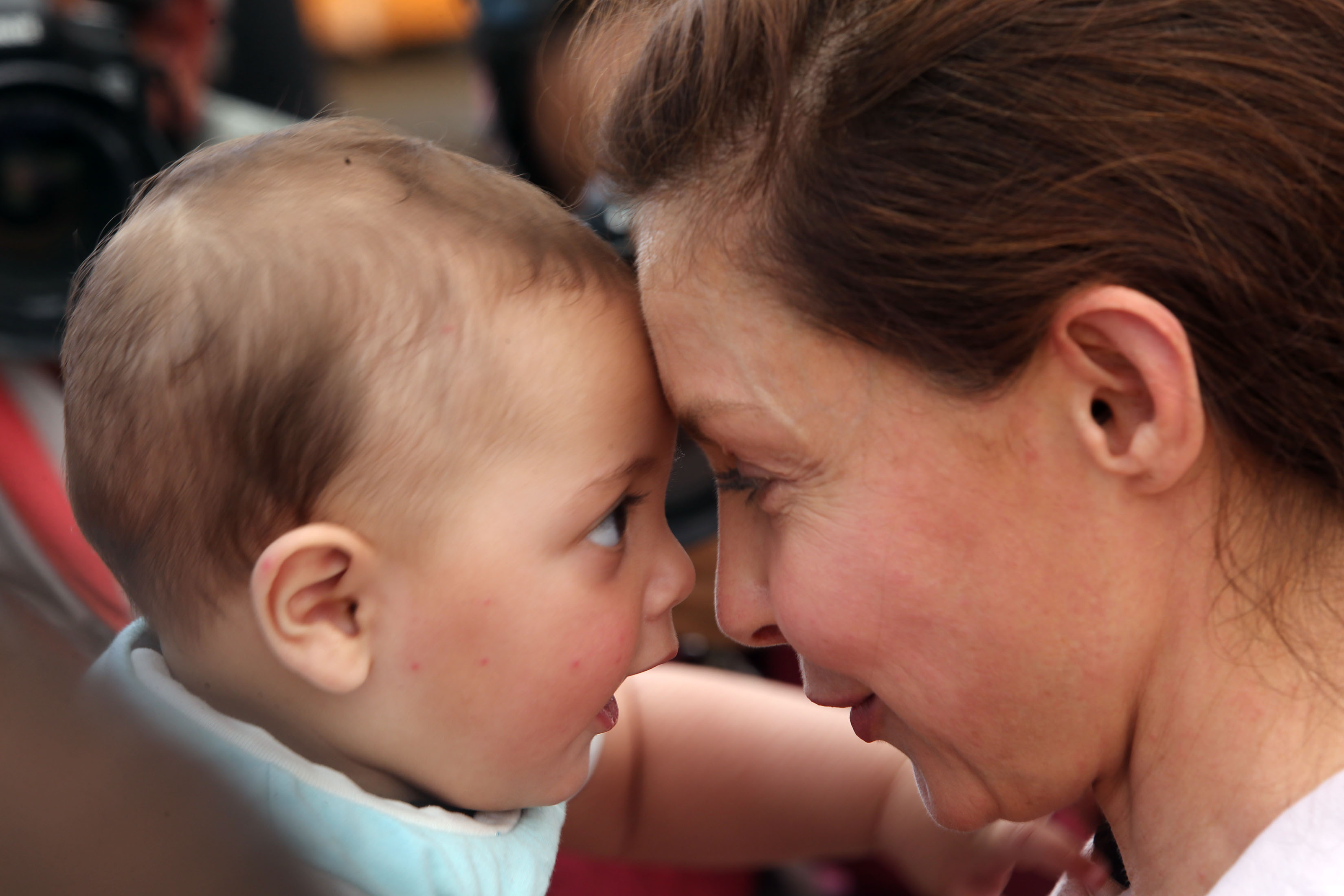 Goodwill Ambassador for the United Nations Population Fund (UNFPA) and actress Ashley Judd interacts with a Syrian refugee child during her visit to the gynecology clinic for Syrian refugee women in the Zaatari Refugee Camp in Jordan on April 10, 2016.