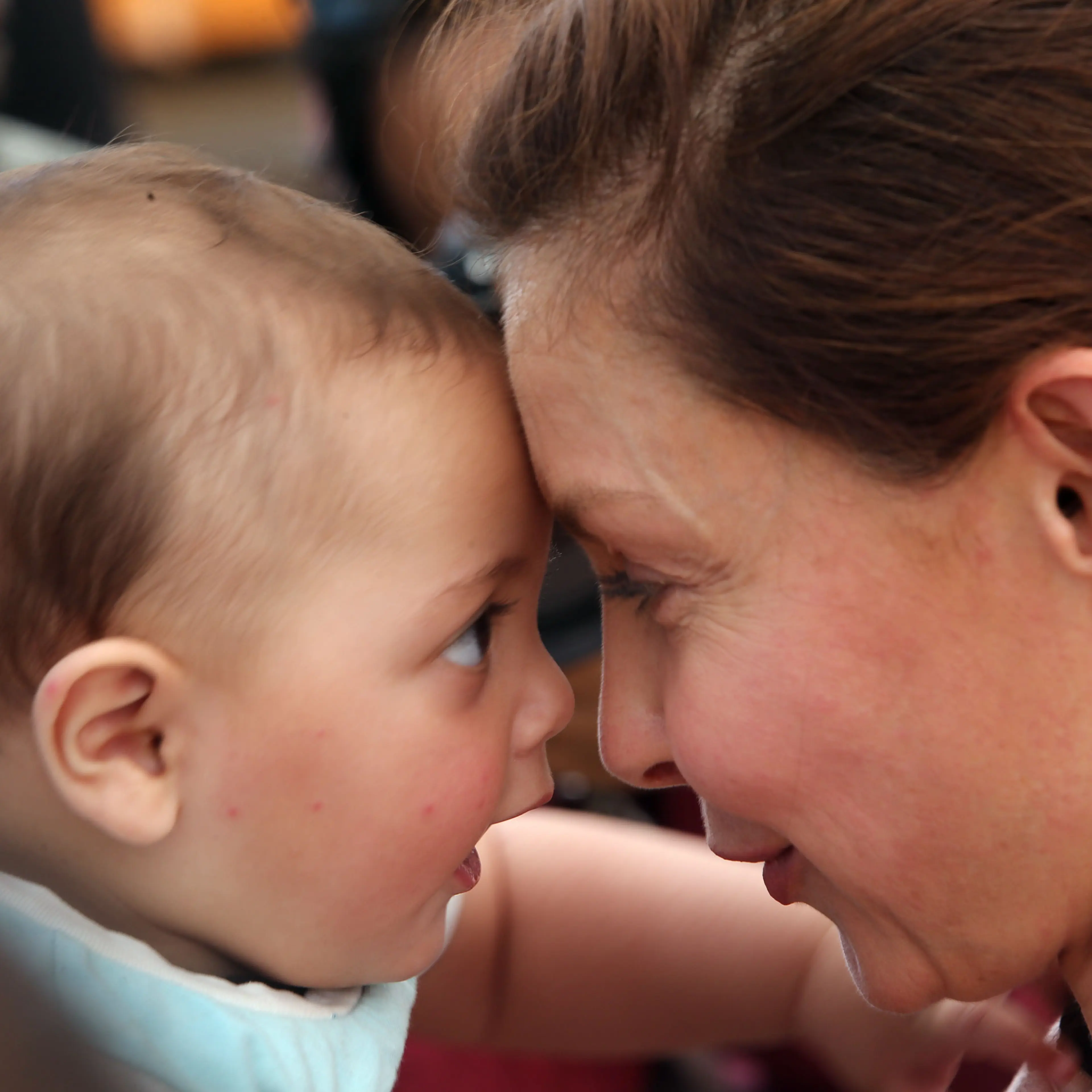 Goodwill Ambassador for the United Nations Population Fund (UNFPA) and actress Ashley Judd interacts with a Syrian refugee child during her visit to the gynecology clinic for Syrian refugee women in the Zaatari Refugee Camp in Jordan on April 10, 2016.