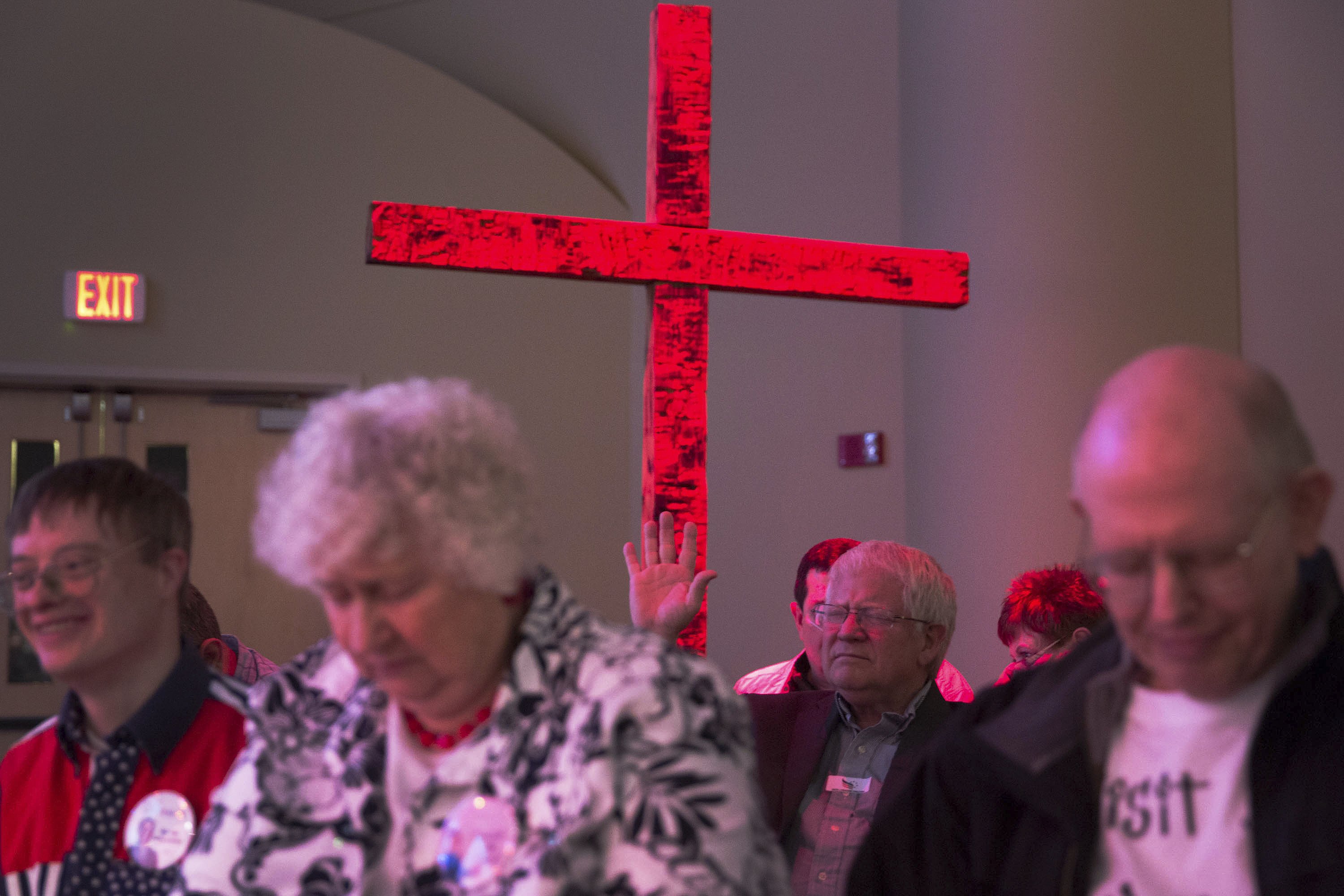 Attendees pray during the Iowa Faith & Freedom Coalition event for 2016 Republican presidential contenders at the Point of Grace Church in Waukee, Iowa, April 25, 2015.
