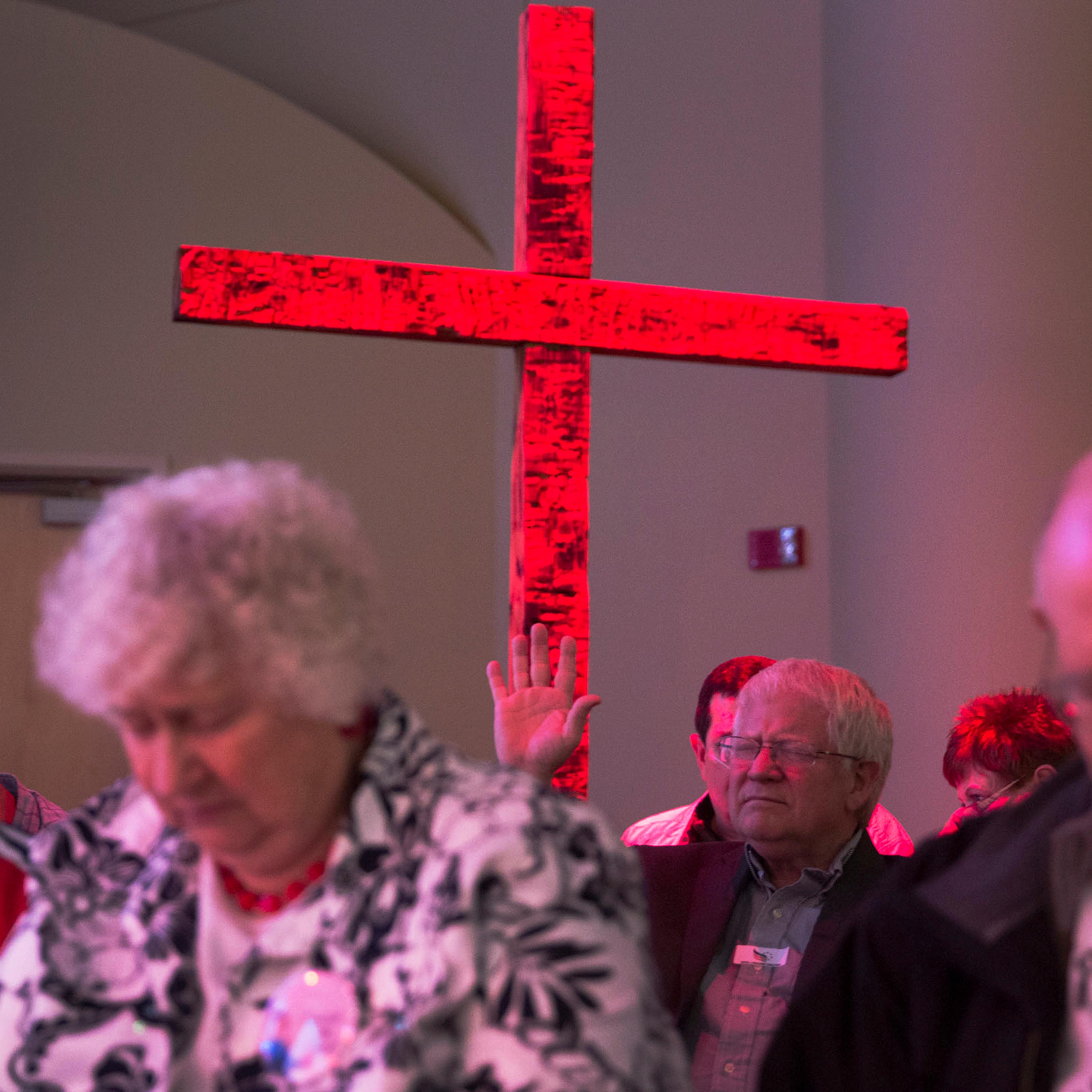 Attendees pray during the Iowa Faith & Freedom Coalition event for 2016 Republican presidential contenders at the Point of Grace Church in Waukee, Iowa, April 25, 2015.