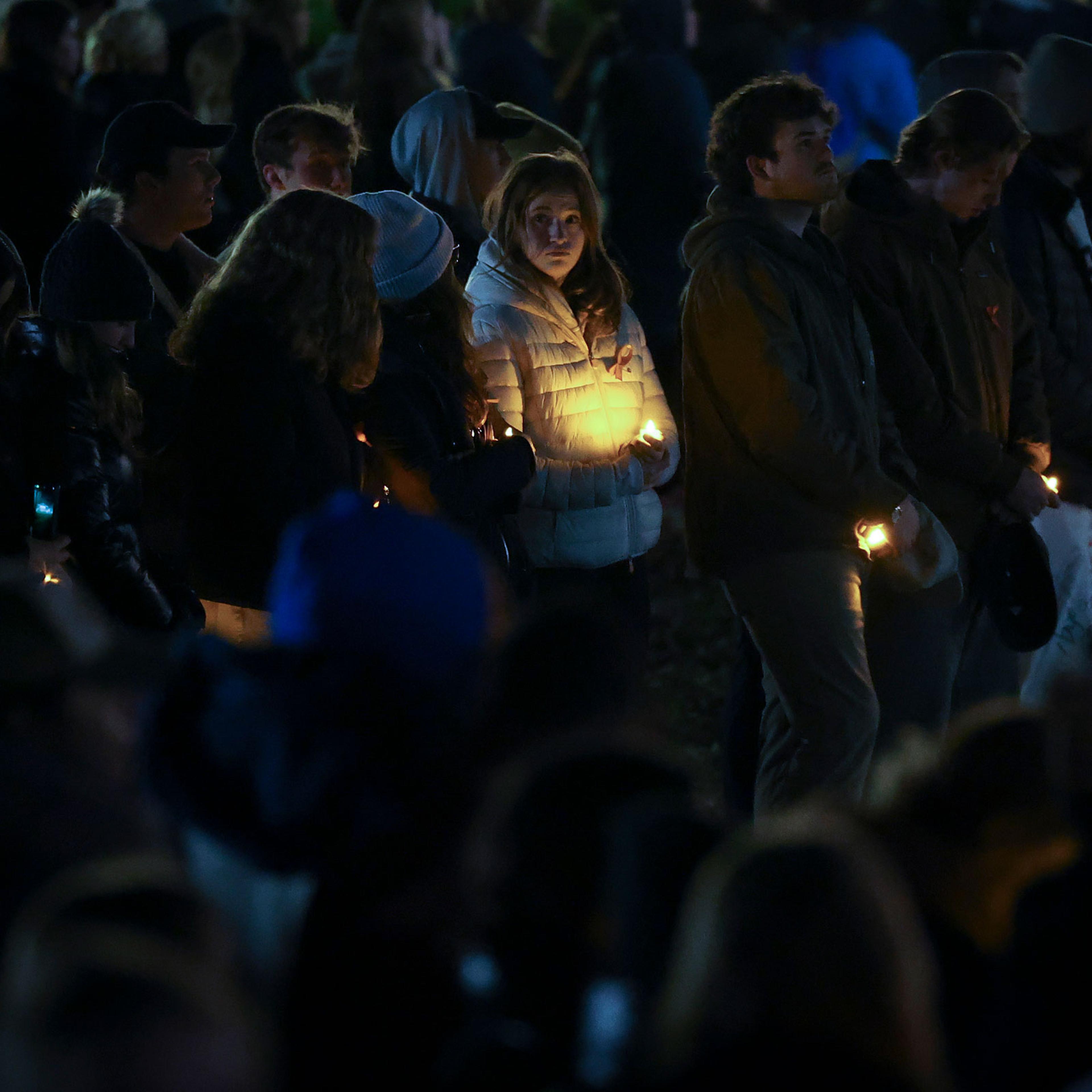 Members of the University of Virginia community attend a candlelight vigil on the South Lawn for the victims of a shooting overnight at the university, on Nov. 14, 2022, in Charlottesville, Va.