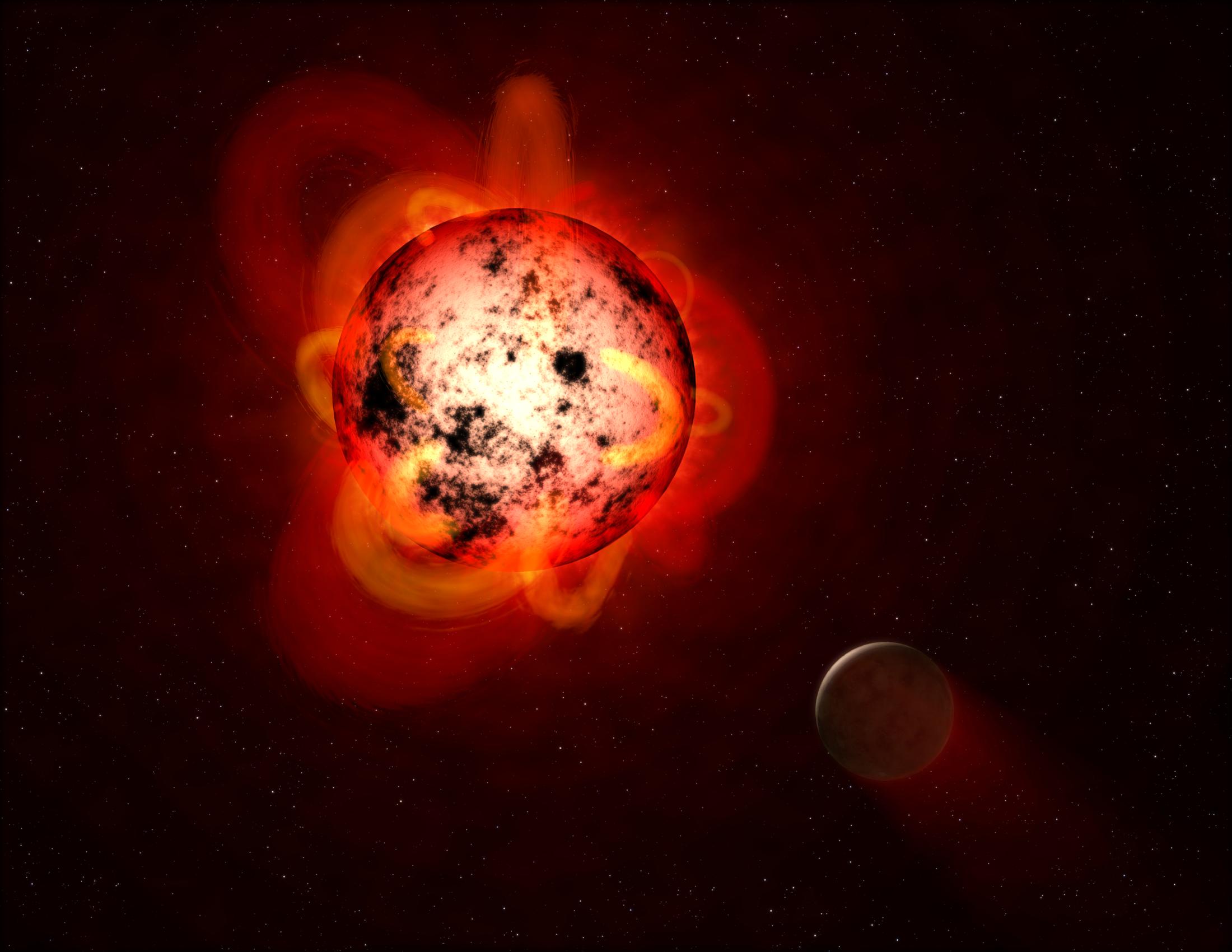 Hot but cold: A red dwarf is cool by stellar standards, but a flare—pictured here in an artist's rendering—could do bad things to a nearby planet.