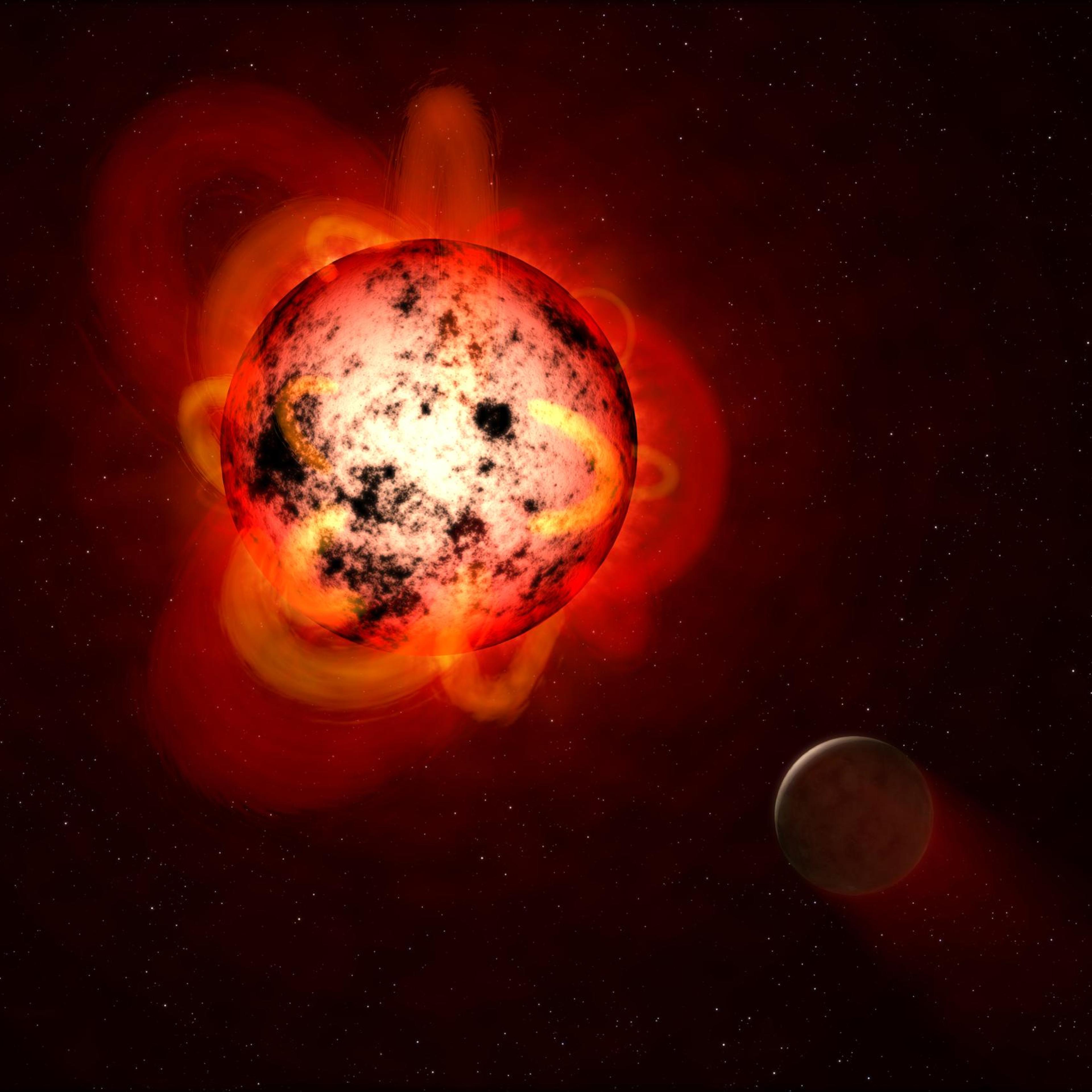 Hot but cold: A red dwarf is cool by stellar standards, but a flare—pictured here in an artist's rendering—could do bad things to a nearby planet.