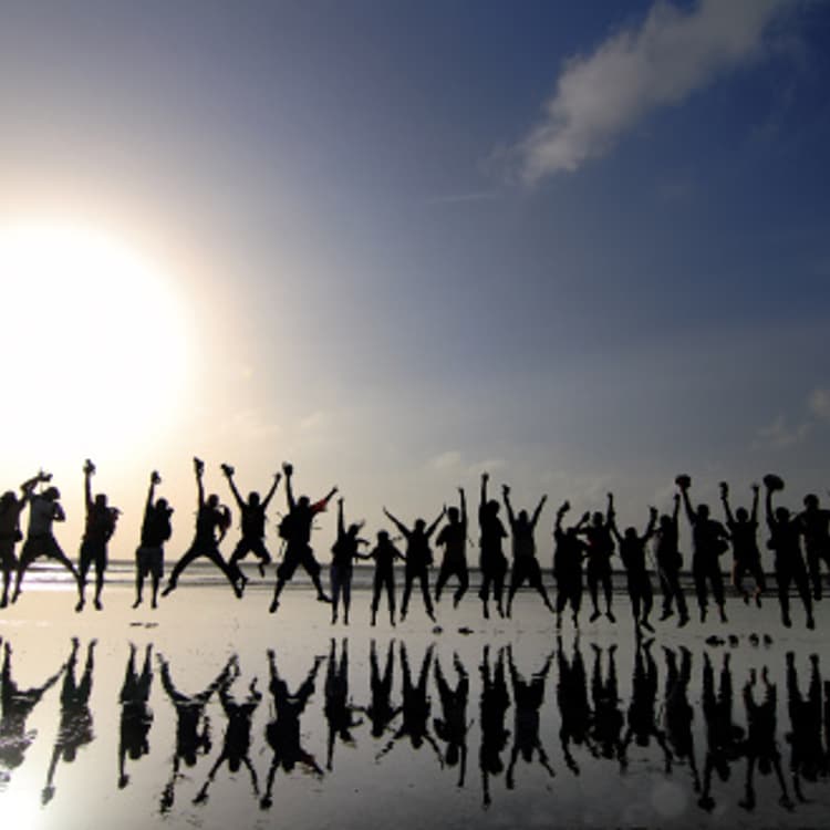 group-people-jumping-backlit