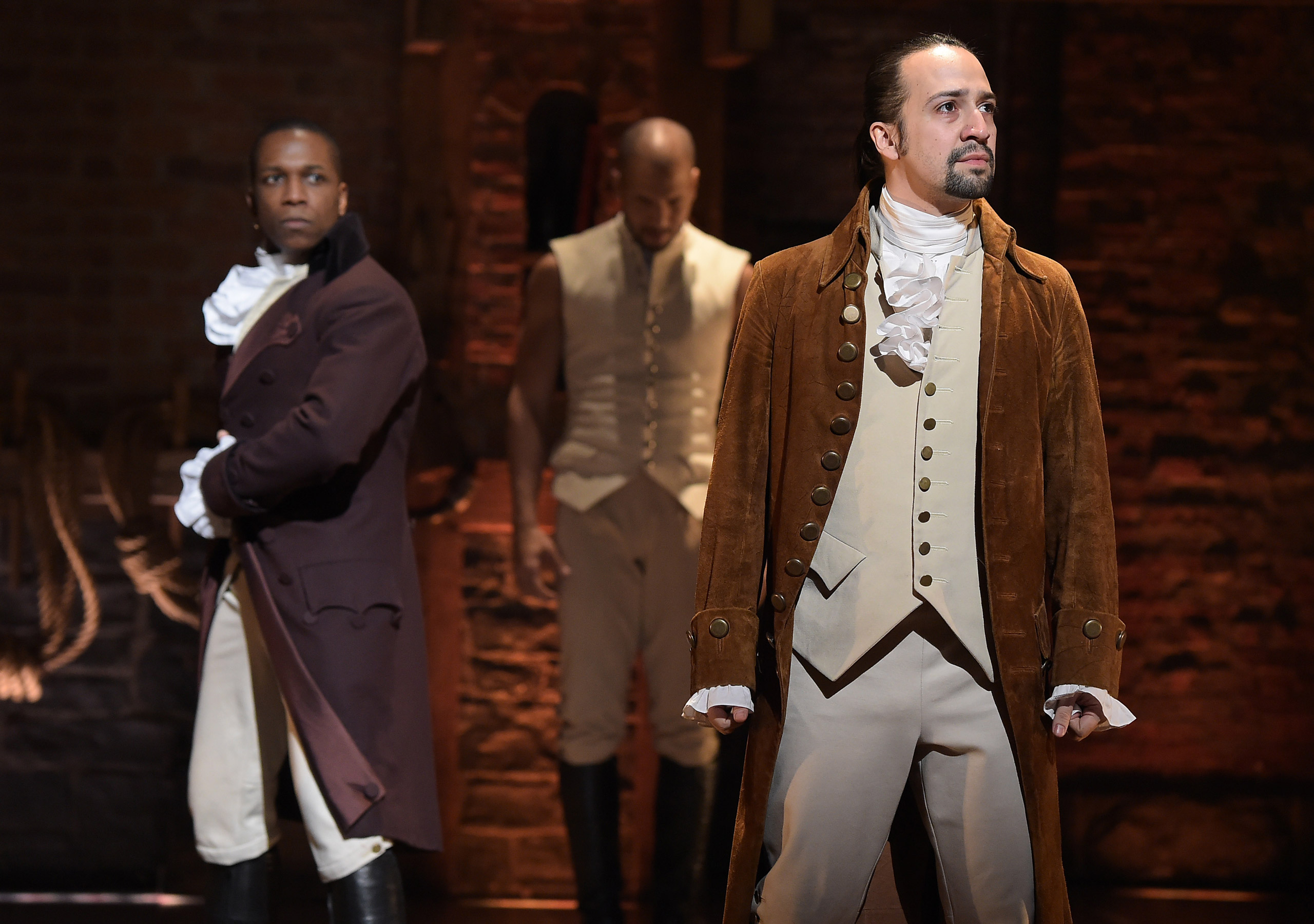 NEW YORK, NY - FEBRUARY 15: Actor Leslie Odom, Jr. (L) and actor, composer Lin-Manuel Miranda (R) perform on stage during "Hamilton" GRAMMY performance for The 58th GRAMMY Awards at Richard Rodgers Theater on February 15, 2016 in New York City. (Photo by