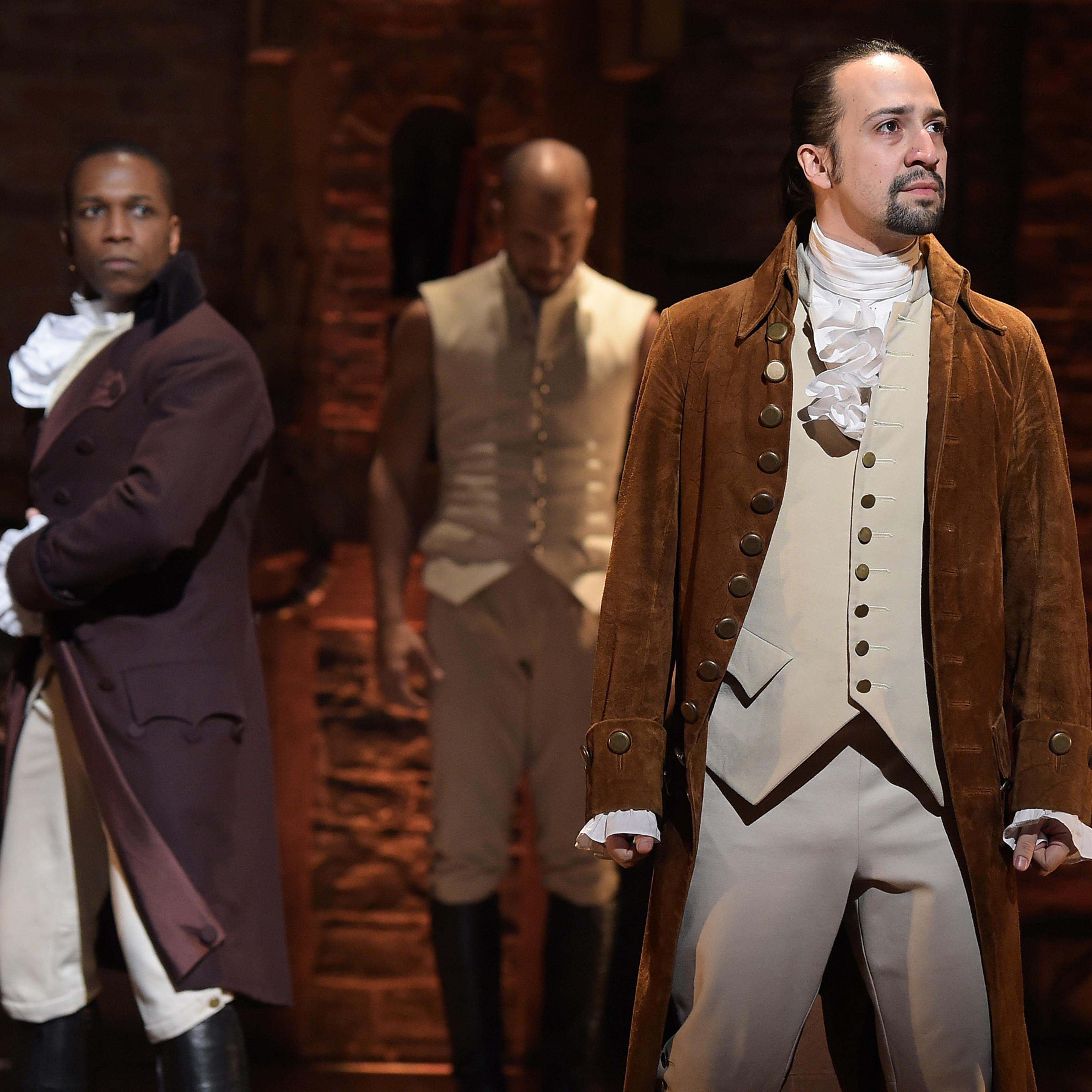 NEW YORK, NY - FEBRUARY 15: Actor Leslie Odom, Jr. (L) and actor, composer Lin-Manuel Miranda (R) perform on stage during "Hamilton" GRAMMY performance for The 58th GRAMMY Awards at Richard Rodgers Theater on February 15, 2016 in New York City. (Photo by