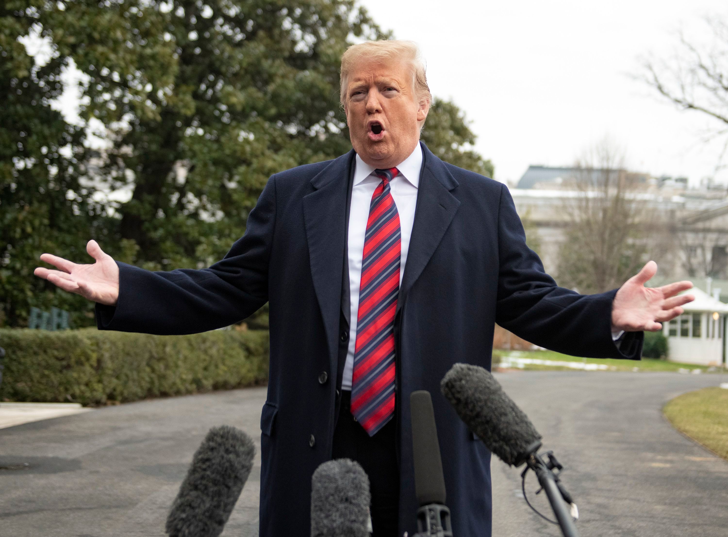 President Donald Trump departs speaks to the media