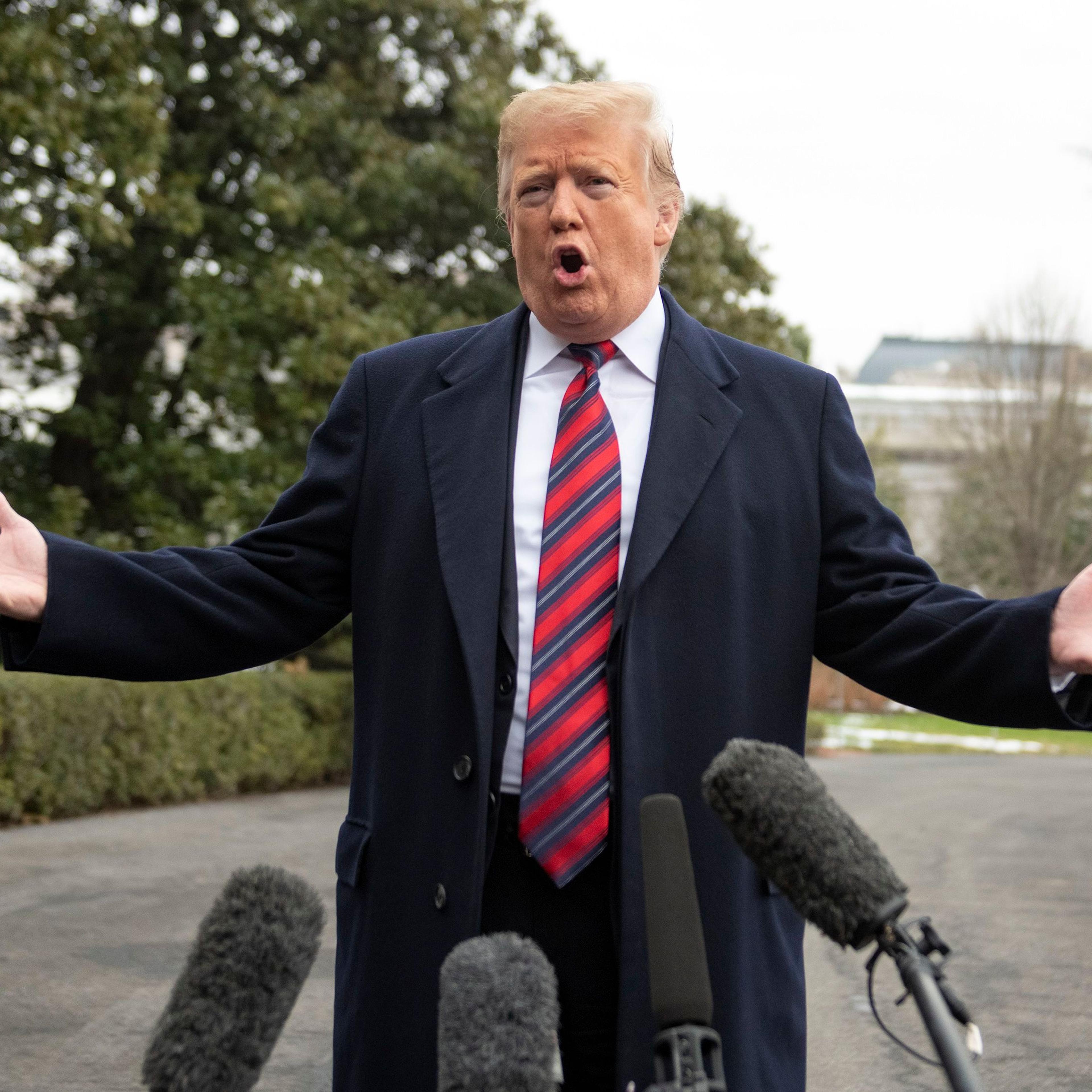 President Donald Trump departs speaks to the media