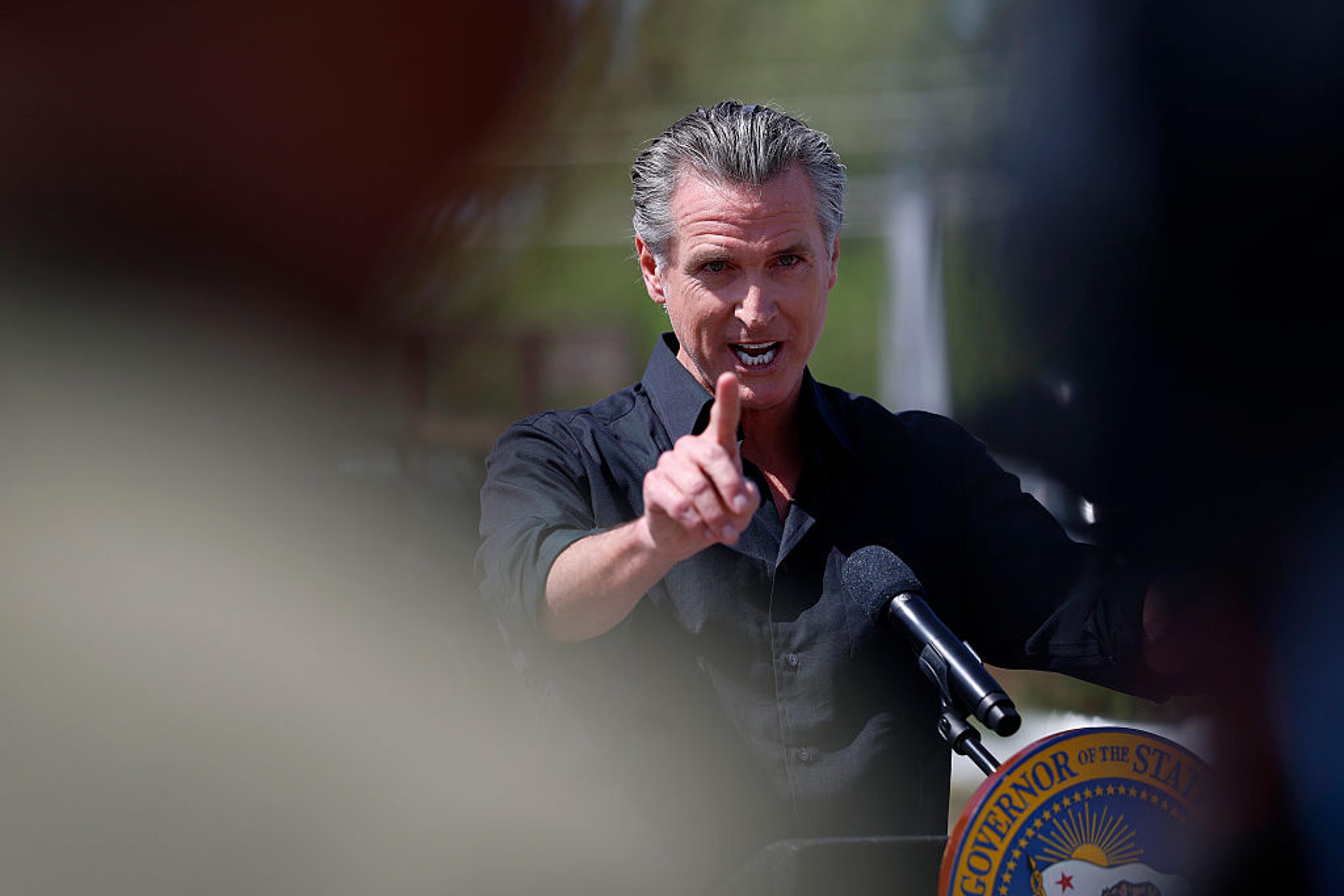 Calif. Gov. Gavin Newsom speaks during a news conference at Gemperle Orchard in Ceres, California on April 16, 2025.