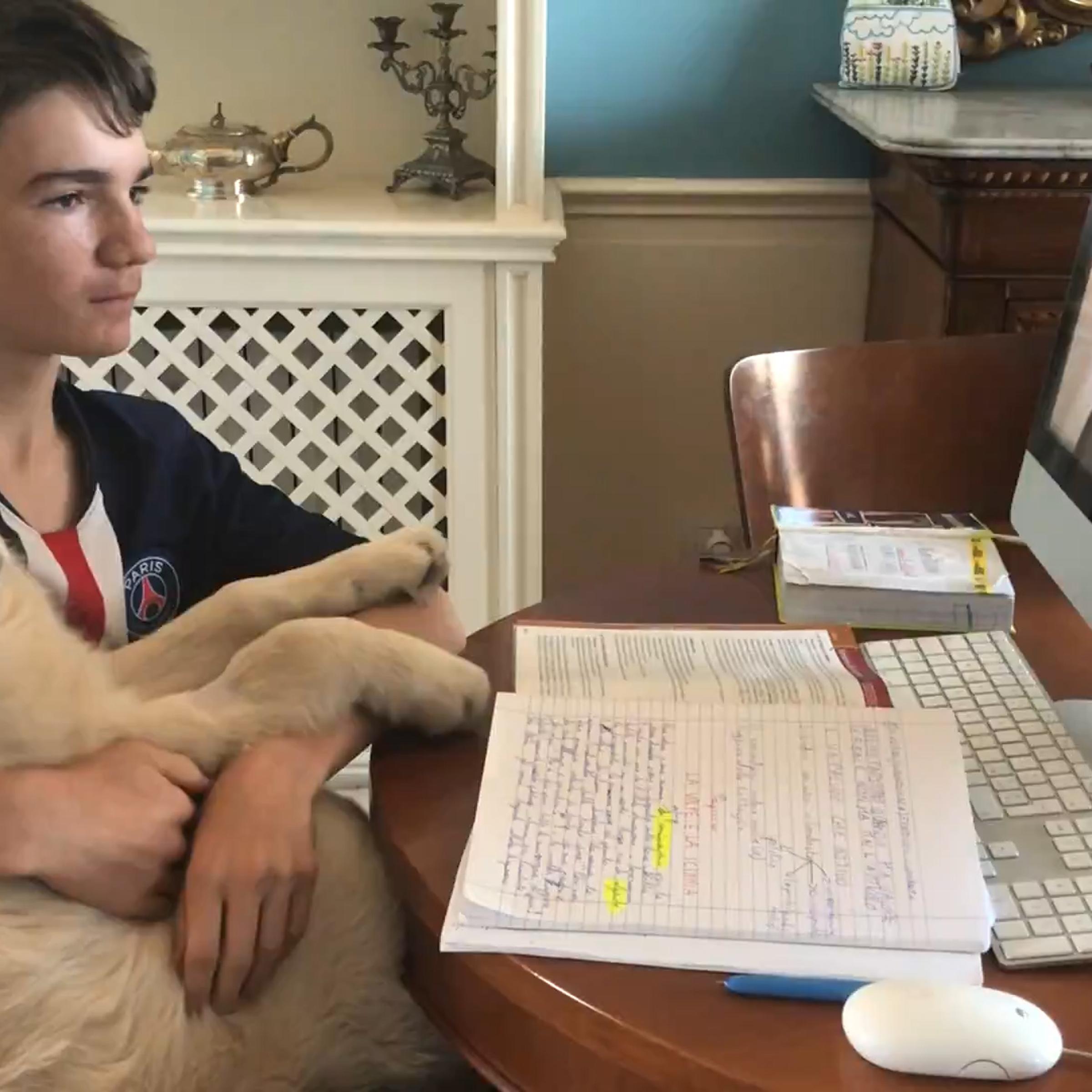 Leonardo Bruti Liberati takes an online high school course during the coronavirus lockdown in Italy.
