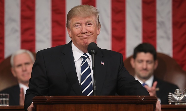 Vice President Mike Pence (L) and Speaker of the House Paul Ryan (R) listen as US President Donald J. Trump (C) delivers his first address to a joint session of Congress from the floor of the House of Representatives in Washington, DC, USA, 28 February 2