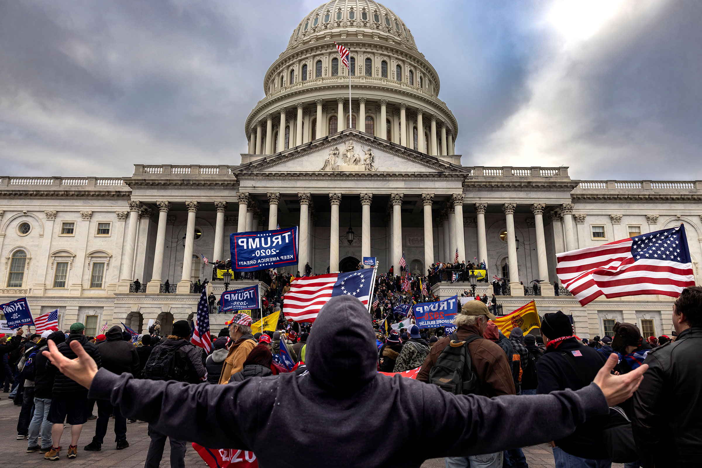 Trump supporters protest in front of the Capitol before a crowd stormed
the building on Jan. 6, 2021.