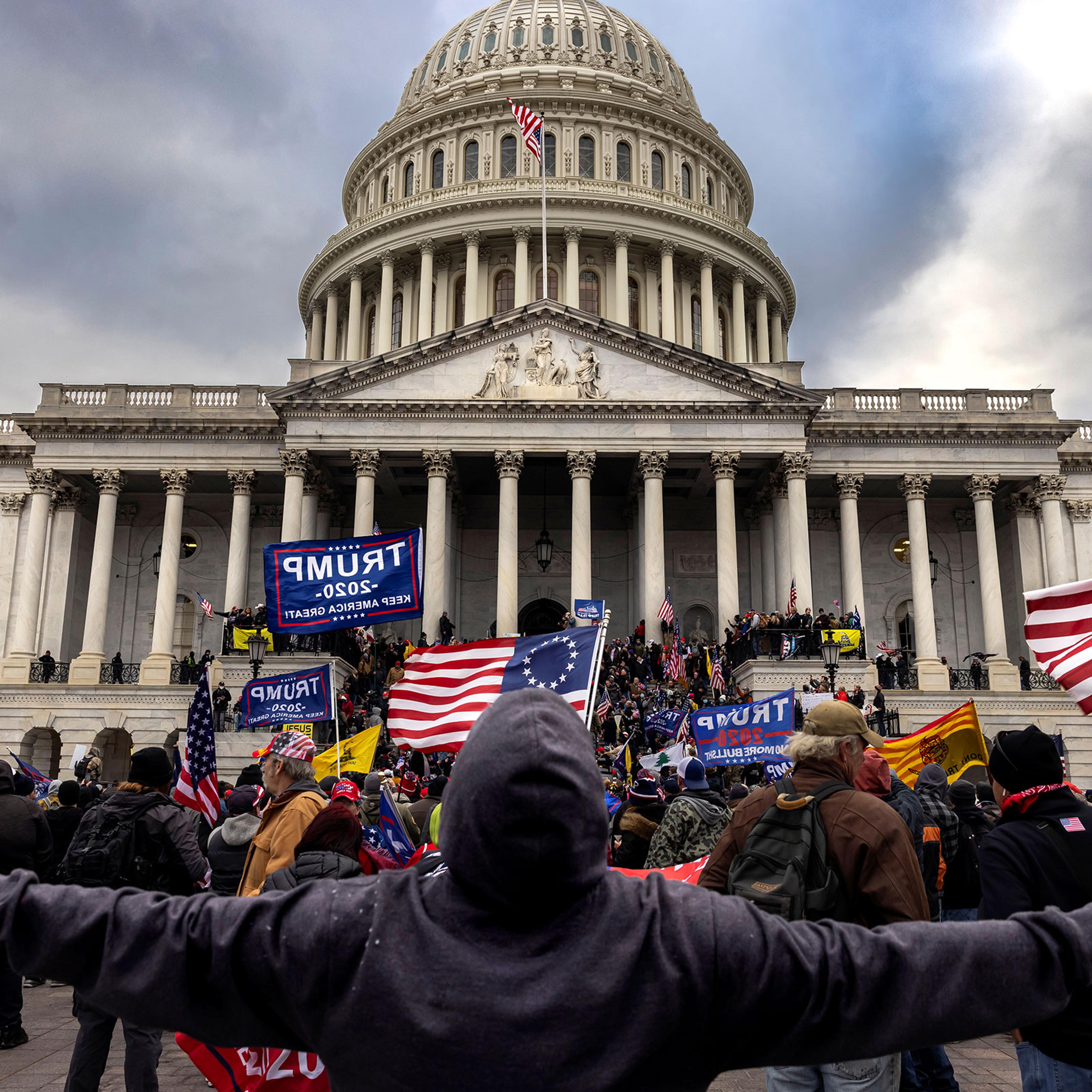 Trump supporters protest in front of the Capitol before a crowd stormed
the building on Jan. 6, 2021.