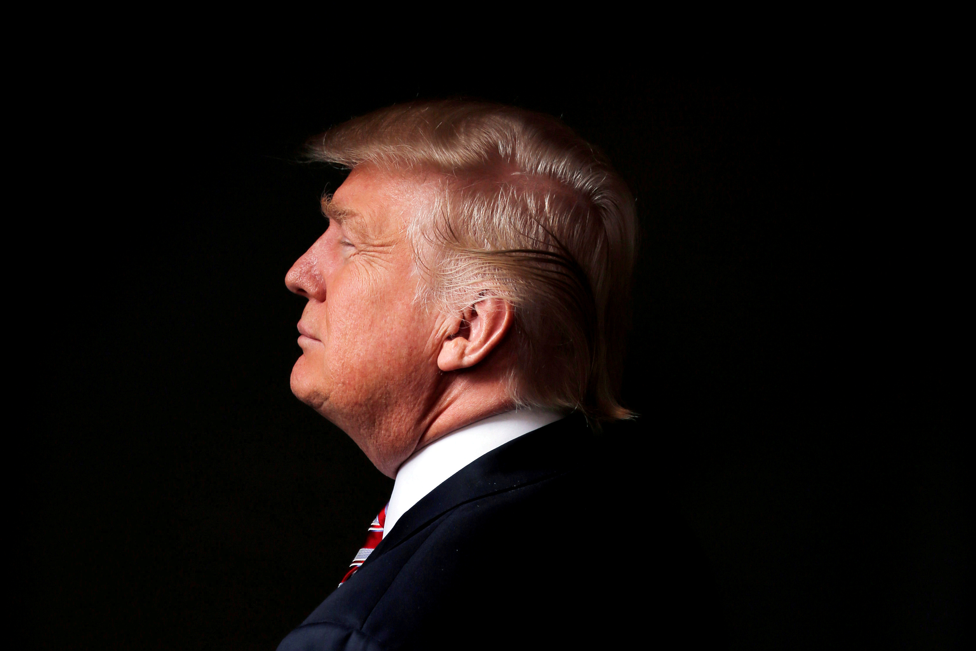 FILE PHOTO -  Republican U.S. presidential candidate Donald Trump poses for a photo after an interview with Reuters in his office in Trump Tower, in the Manhattan borough of New York City