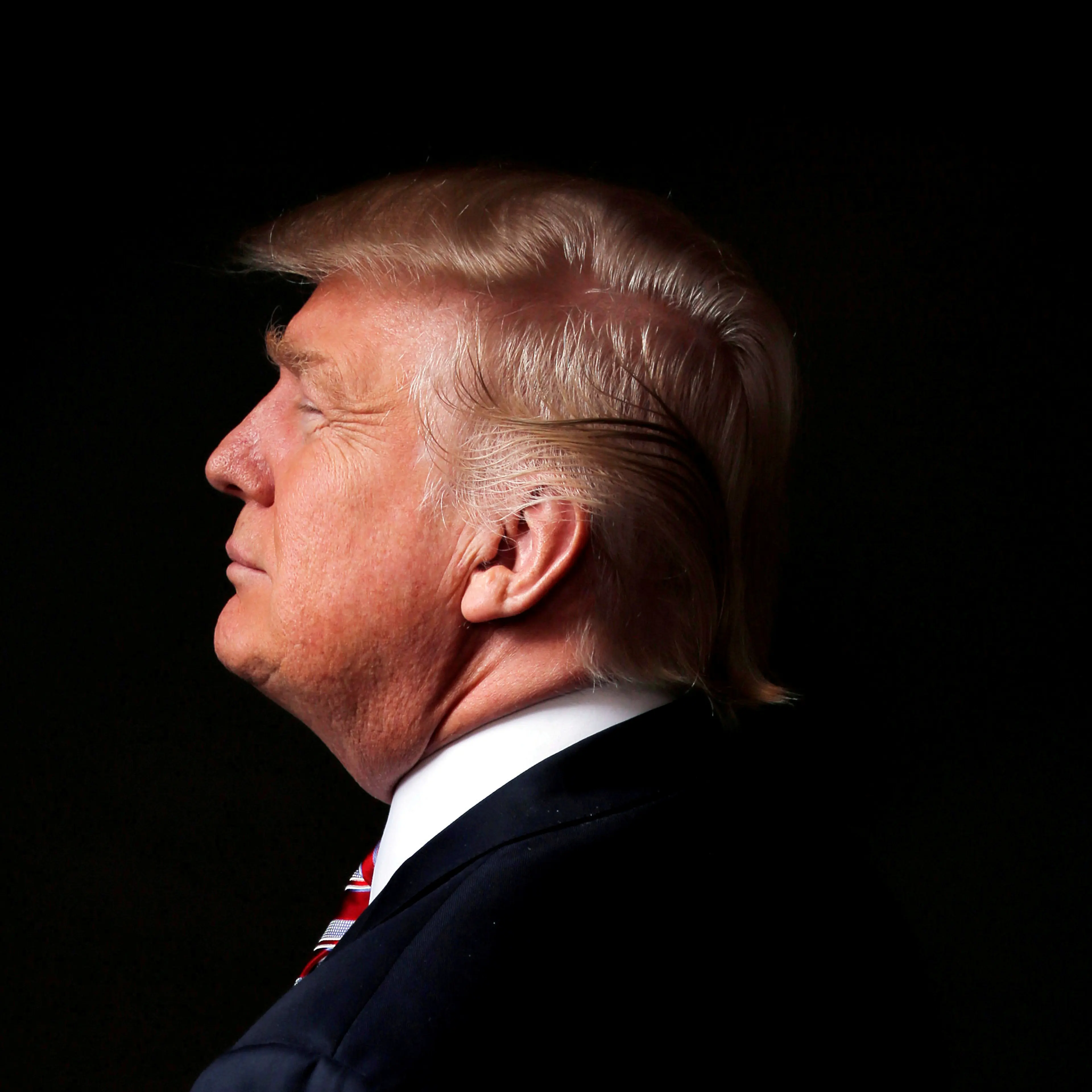 FILE PHOTO - Republican U.S. presidential candidate Donald Trump poses for a photo after an interview with Reuters in his office in Trump Tower, in the Manhattan borough of New York City