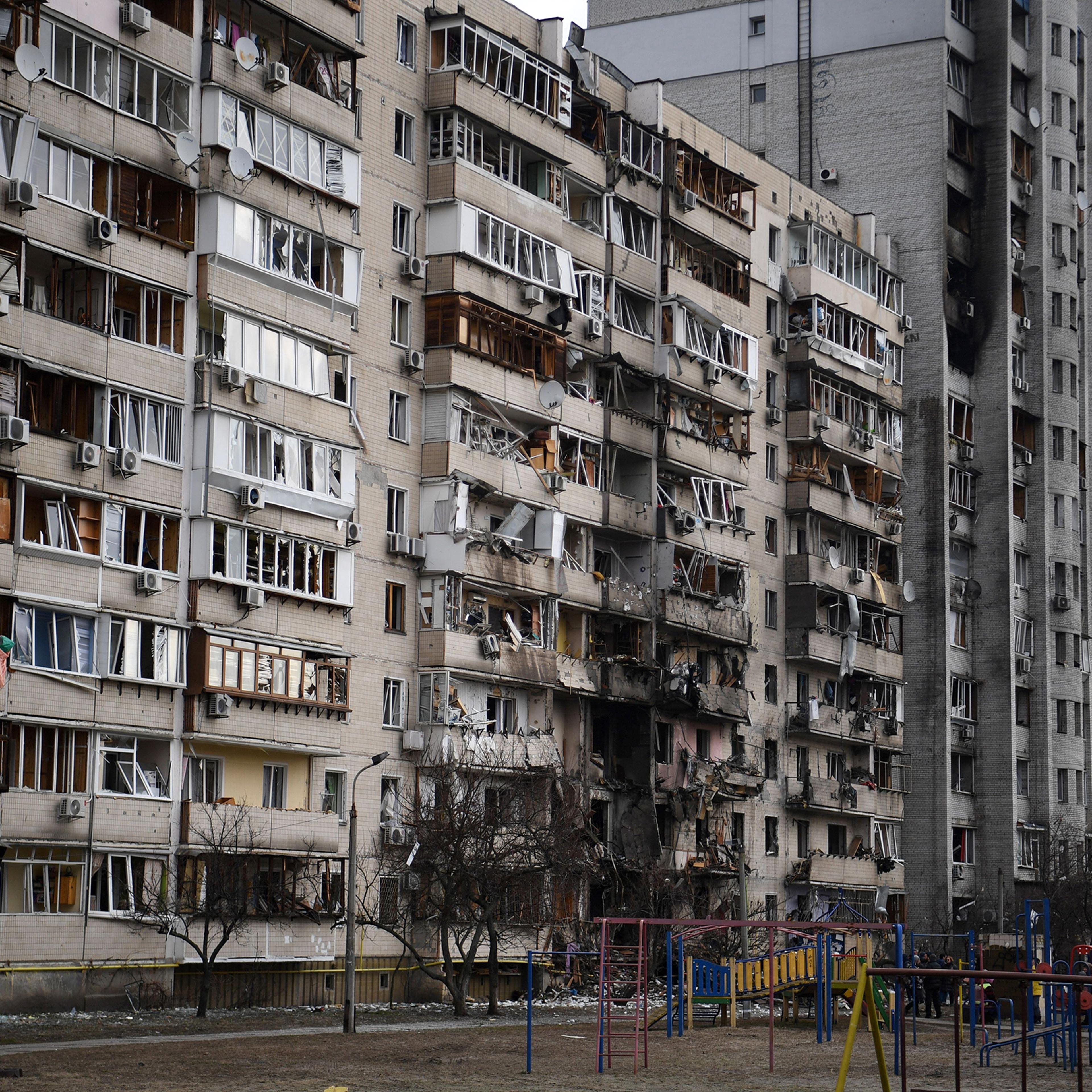 A general view of a damaged residential building at Koshytsa Street, a suburb of the Ukrainian capital Kyiv, where a military shell allegedly hit, on February 25, 2022.