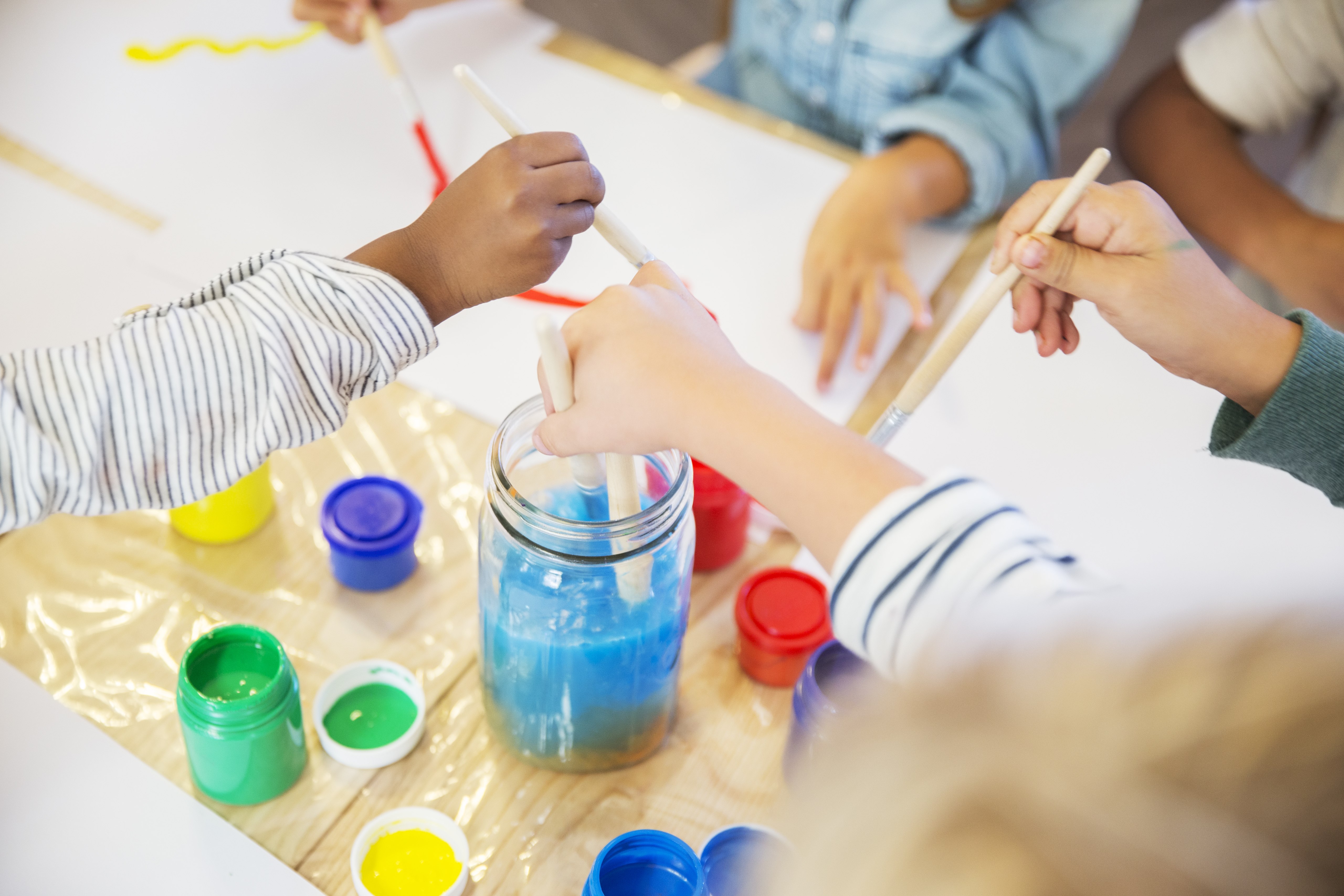 Students painting in class