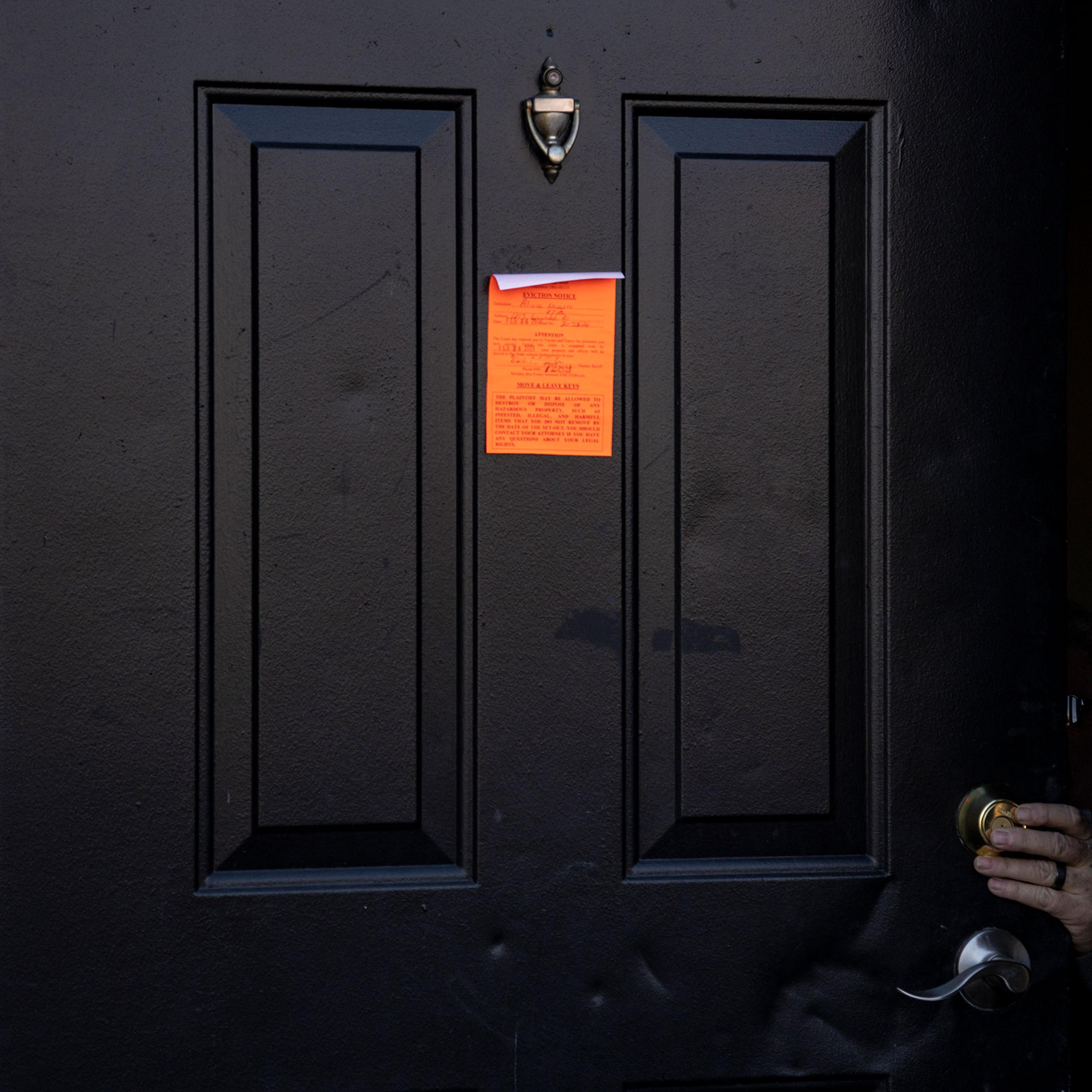 An eviction notice is posted and the lock is changed on a door in the unincorporated community of Galloway west of Columbus, Ohio on March 3, 2021 .