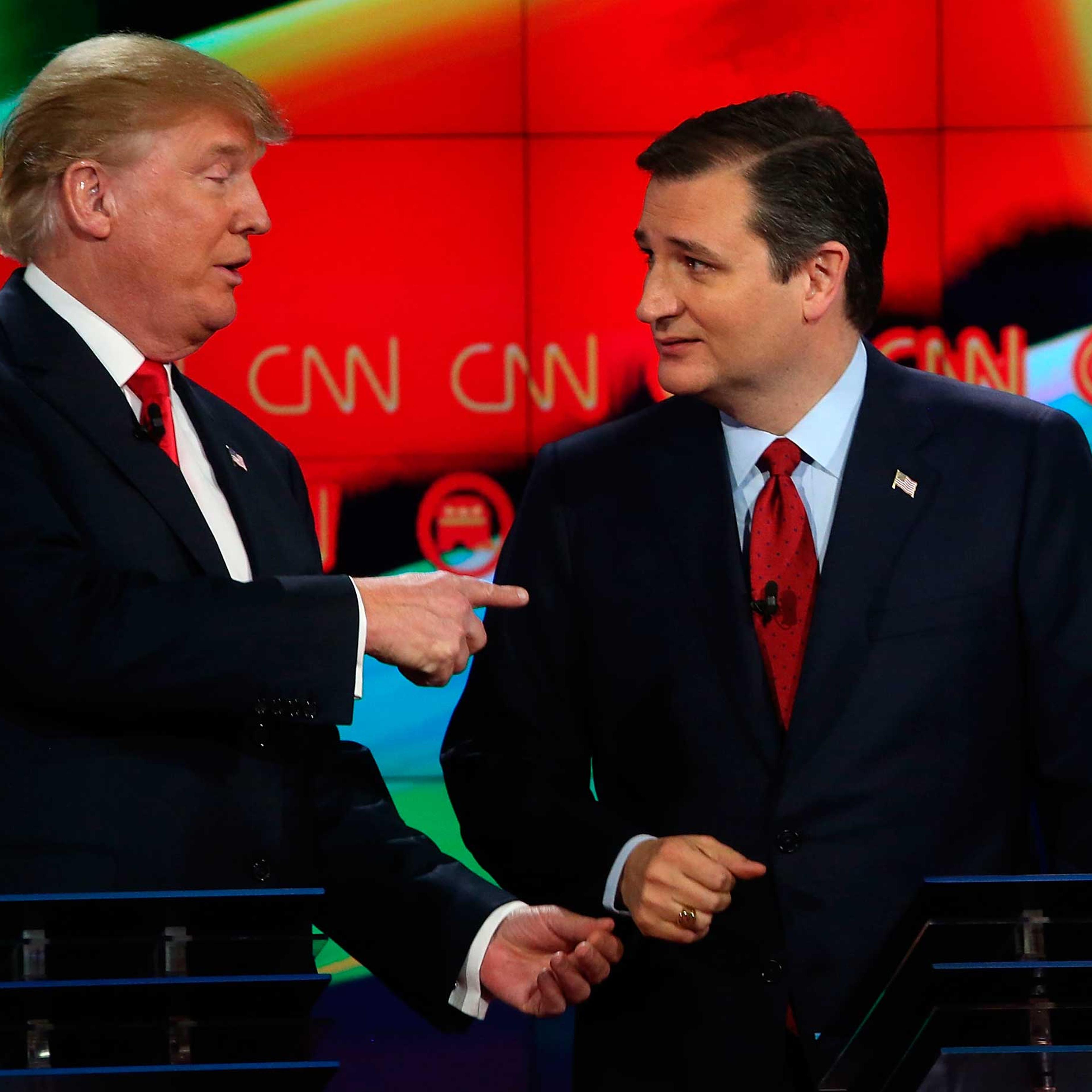 Republican presidential candidates Donald Trump and Sen. Ted Cruz (R-TX) interact at the conclusion of CNN's GOP presidential debate at The Venetian Las Vegas on Dec. 15, 2015.