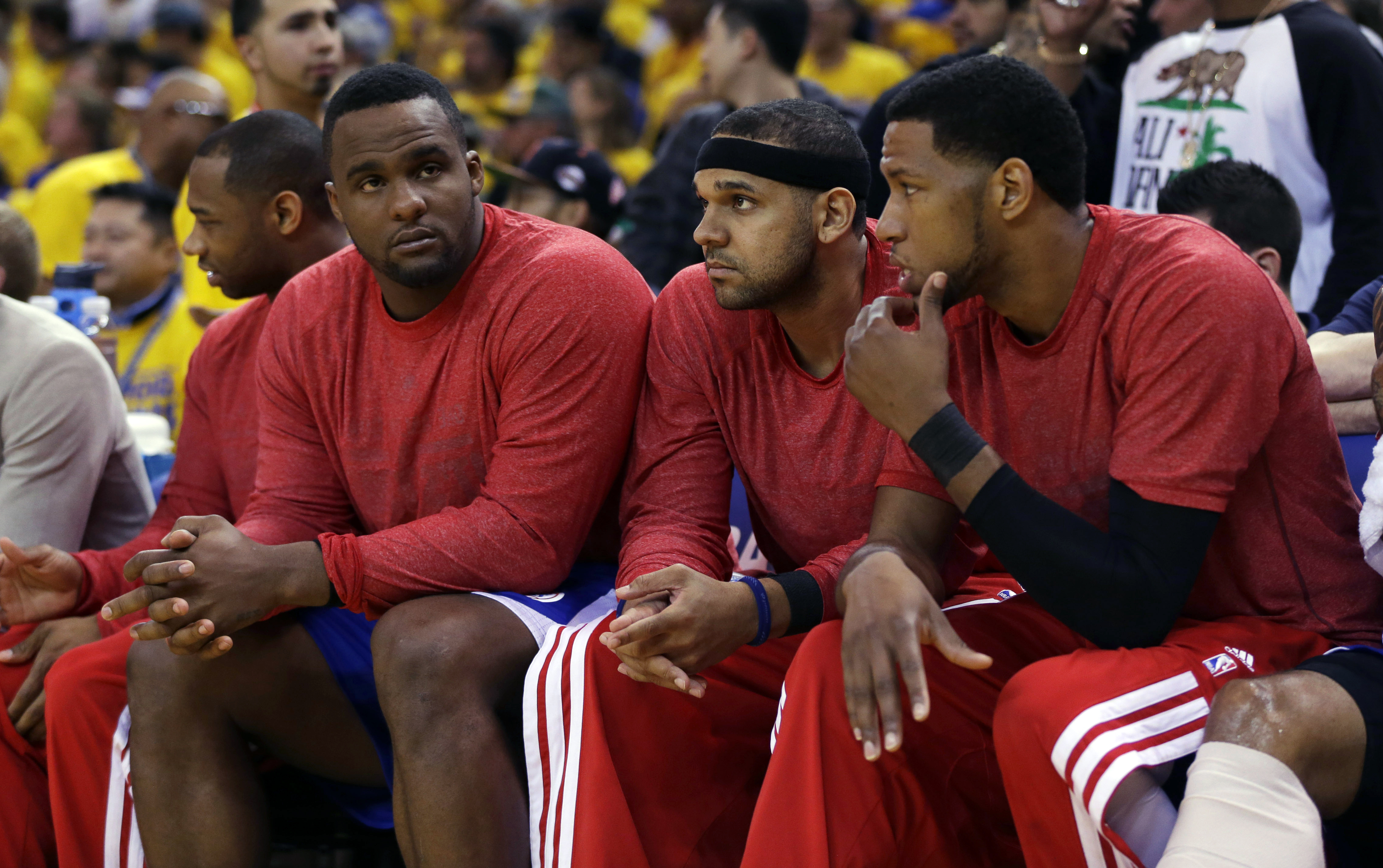 From left: Los Angeles Clippers' Glen Davis, Jared Dudley and Danny Granger watch from the bench during the second half in Game 4 of an opening-round NBA basketball playoff series against the Golden State Warriors on April 27, 2014, in Oakland, Calif.