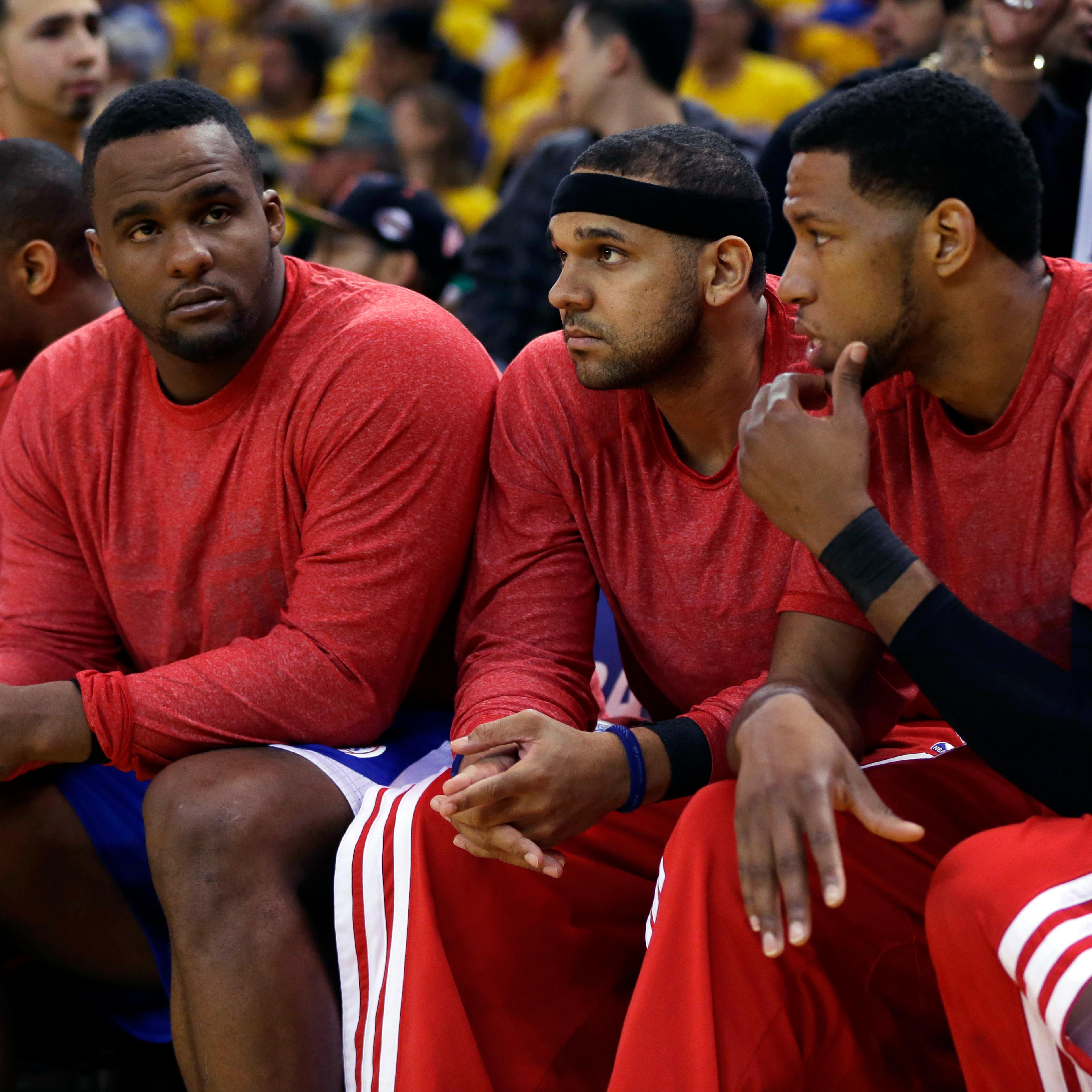 From left: Los Angeles Clippers' Glen Davis, Jared Dudley and Danny Granger watch from the bench during the second half in Game 4 of an opening-round NBA basketball playoff series against the Golden State Warriors on April 27, 2014, in Oakland, Calif.