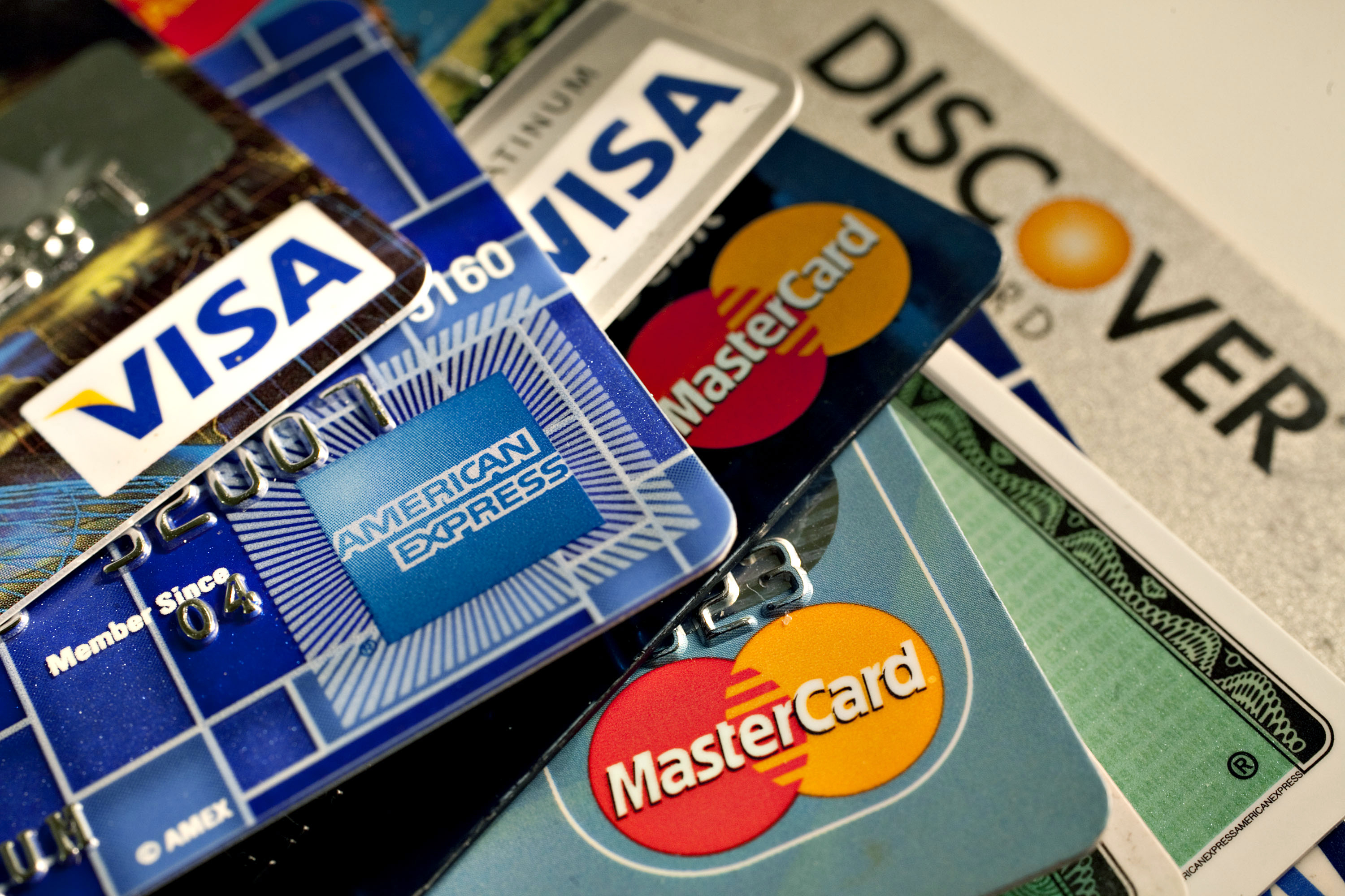 American Express, Discover, MasterCard and Visa credit cards are displayed for a photograph in New York, U.S., on Tuesday, May 18, 2010. Credit-card firms caught off-guard by U.S. Senate passage of curbs on debit fees are facing what one executive sees a