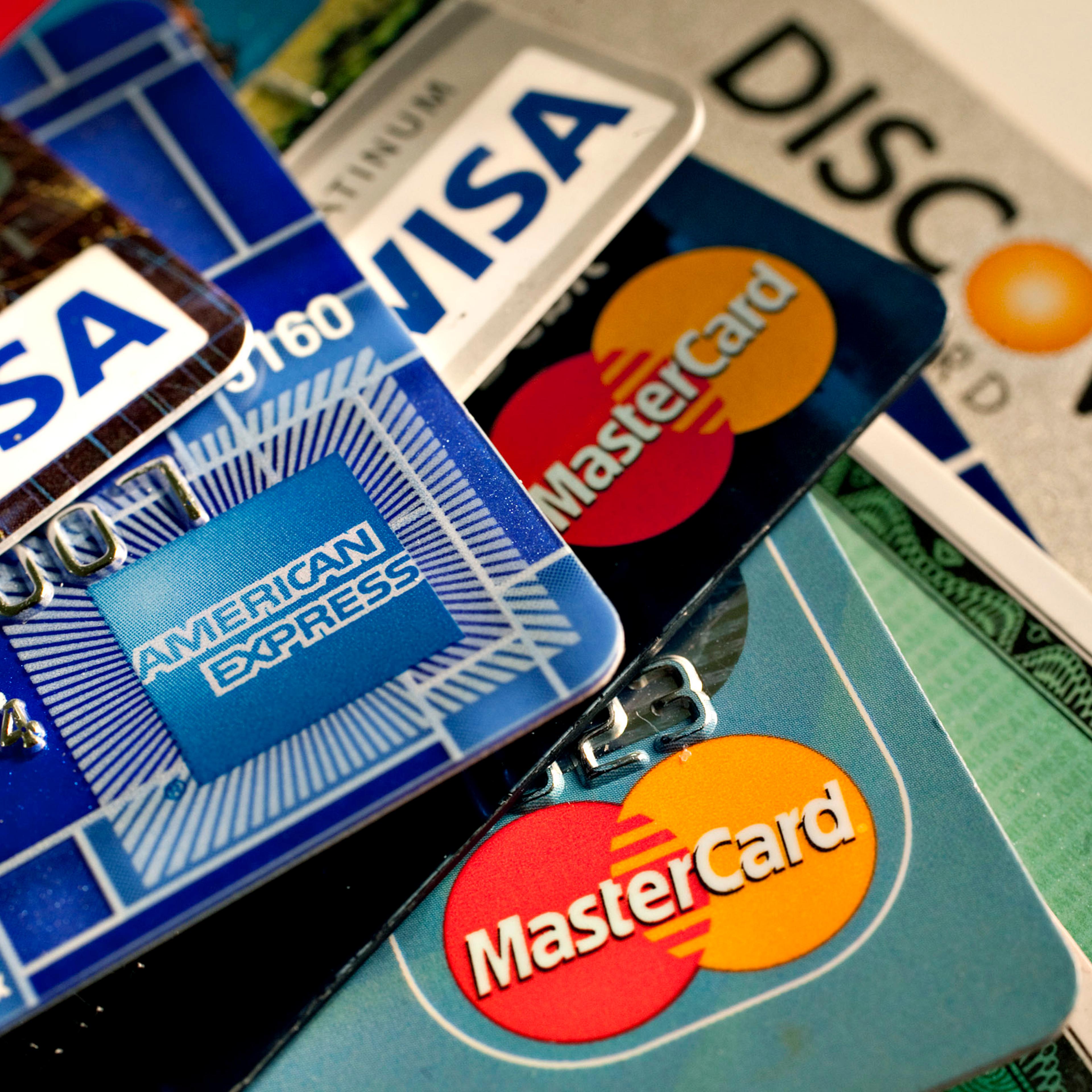 American Express, Discover, MasterCard and Visa credit cards are displayed for a photograph in New York, U.S., on Tuesday, May 18, 2010. Credit-card firms caught off-guard by U.S. Senate passage of curbs on debit fees are facing what one executive sees a