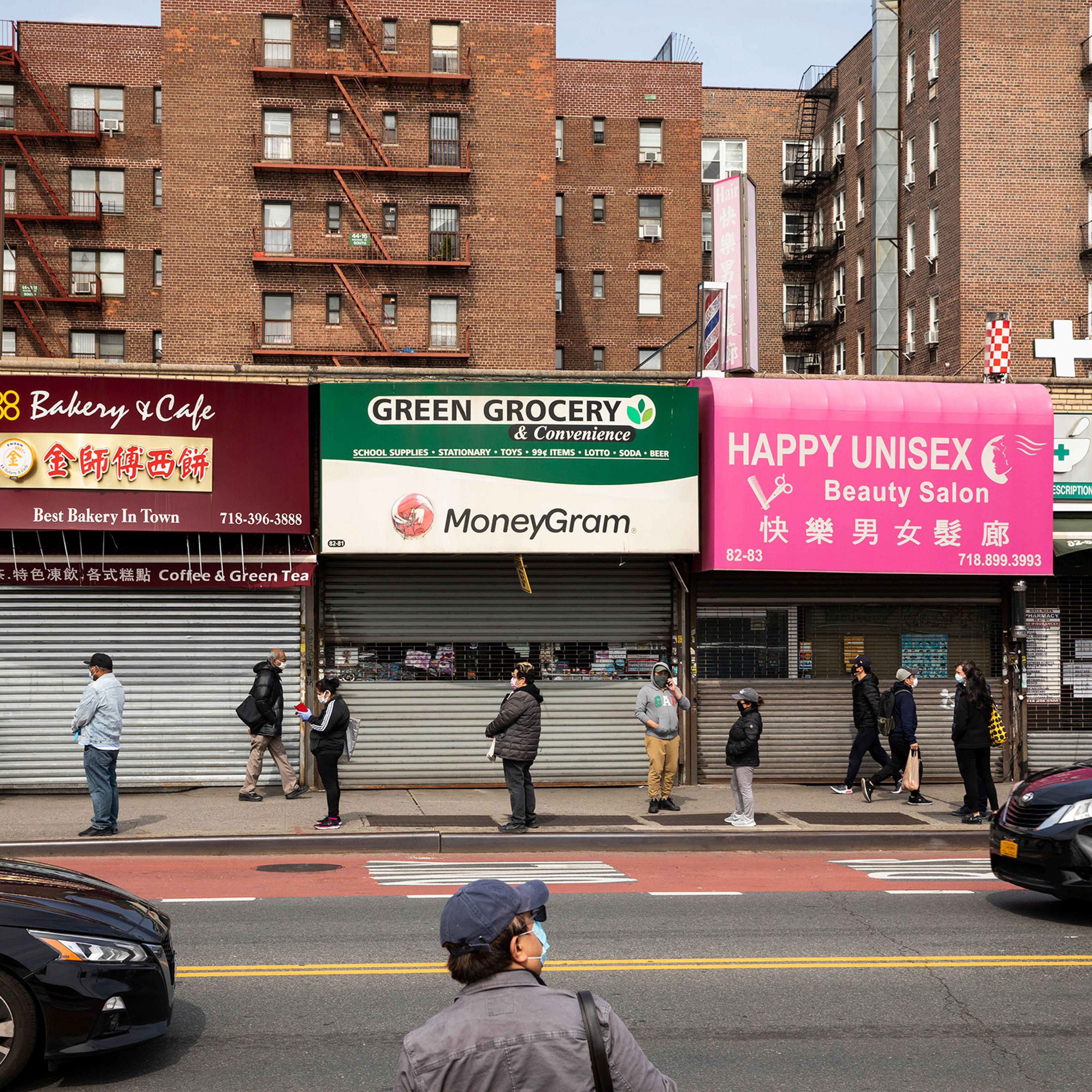 Shuttered businesses in Jackson Heights, Queens, April 19, 2020. (Benjamin Norman/The New York Times)