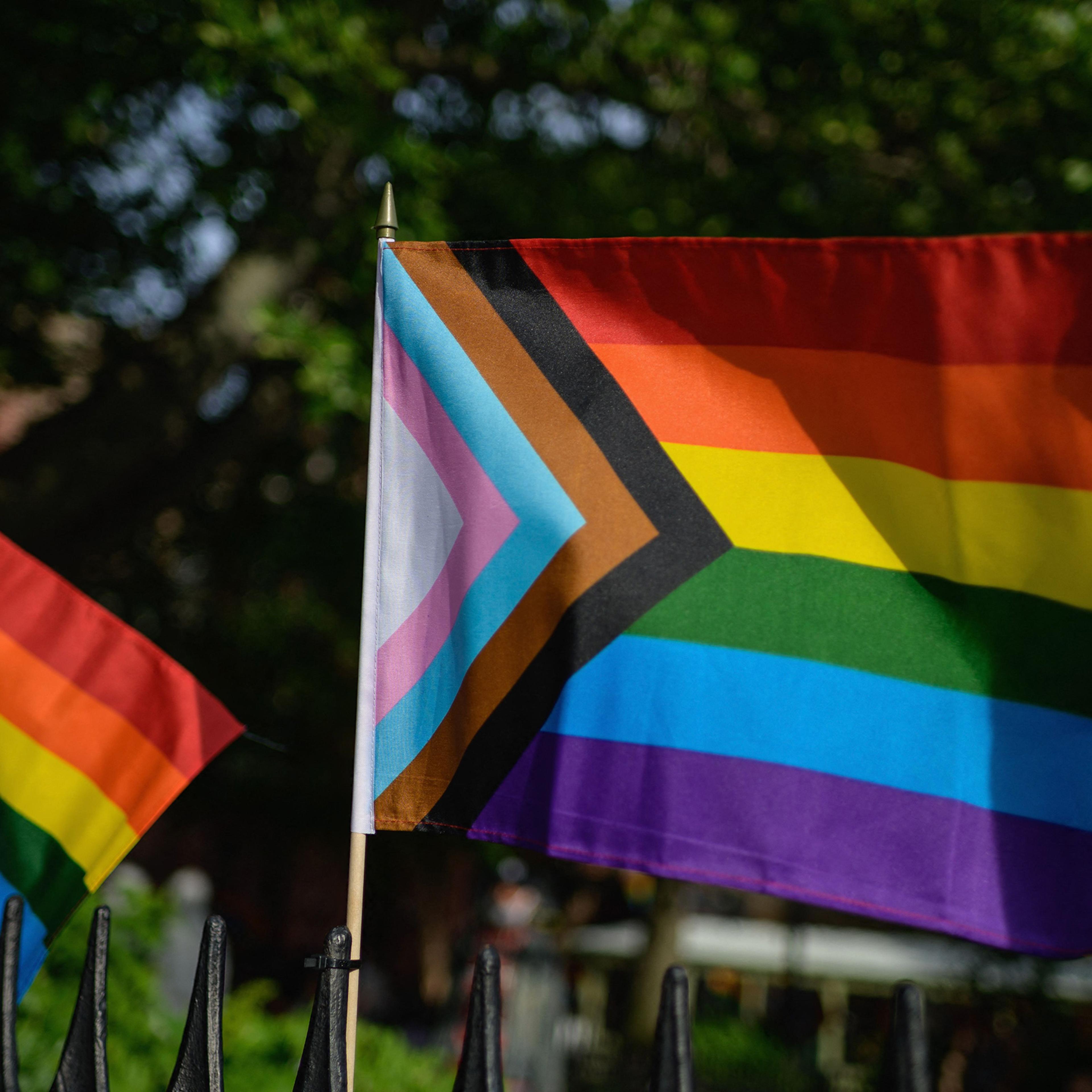 A Progress Pride flag alongside rainbow flags are seen at the Stonewall National Monument, the first US national monument dedicated to LGBTQ history and rights, on June 1, 2020 in New York City.