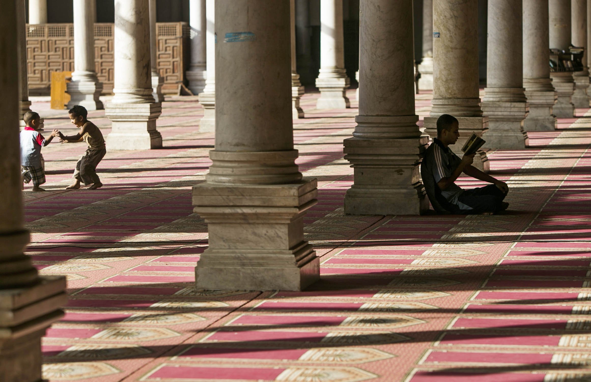 Egyptian children have fun inside a mosque during their fasting hours in a Ramadan afternoon in Cairo June 23, 2014.