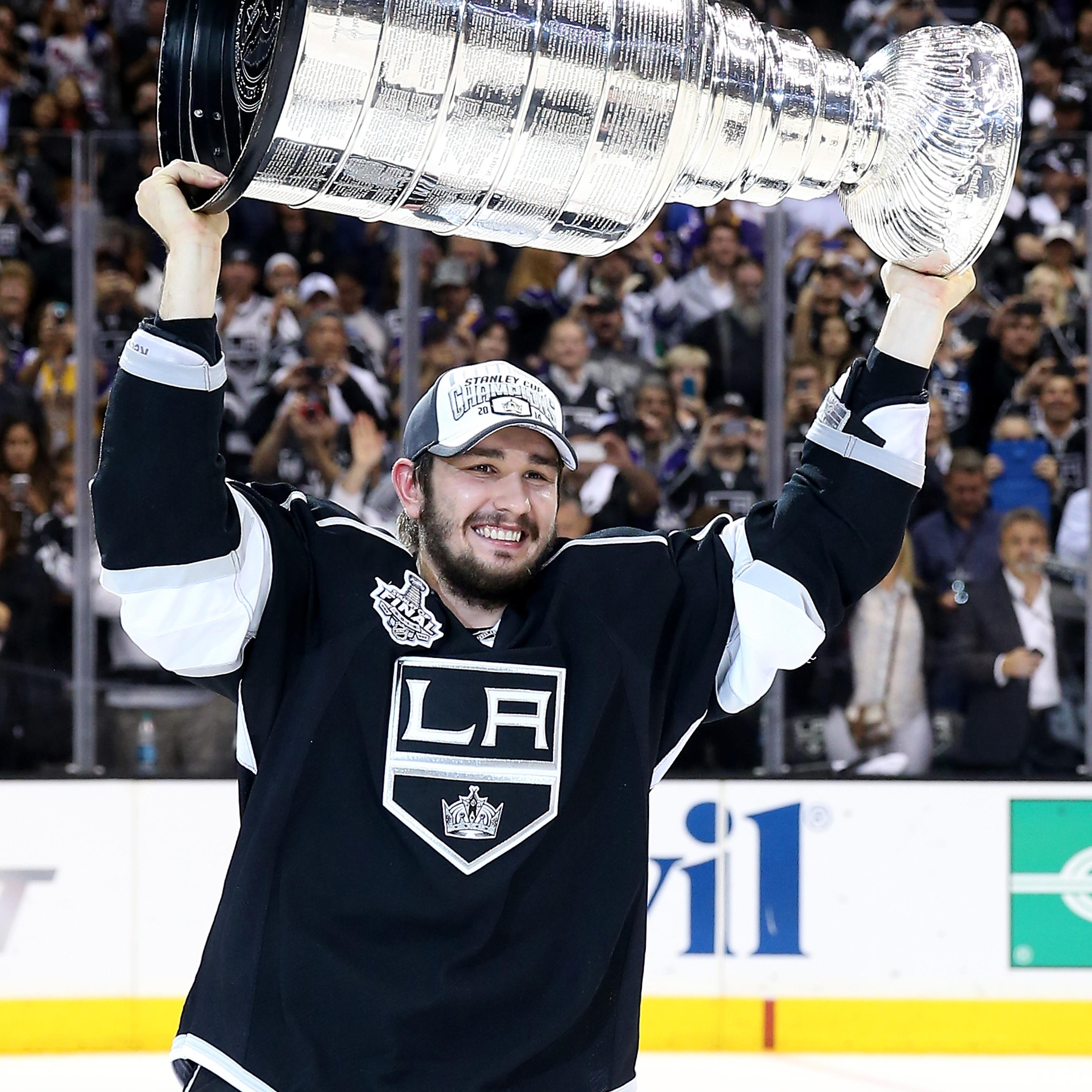 Slava Voynov of the Los Angeles Kings celebrates with the Stanley Cup after the Kings 3-2 double overtime victory against the New York Rangers in Game Five of the 2014 Stanley Cup Final at Staples Center on June 13, 2014 in Los Angeles.