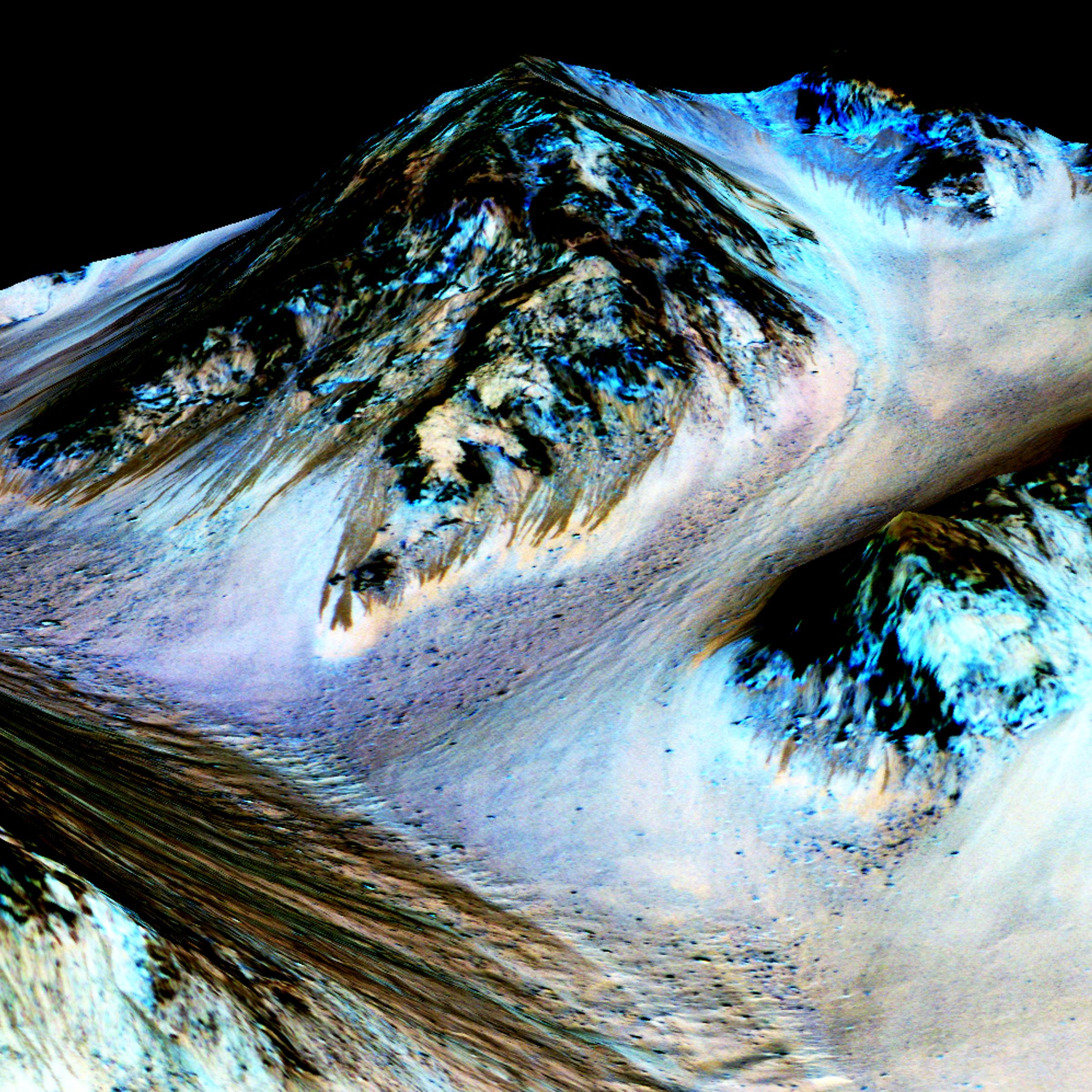 In this handout provided by NASA's Mars Reconnaissance Orbiter, dark, narrow streaks on the slopes of Hale Crater are inferred to be formed by seasonal flow of water on surface of present-day Mars.