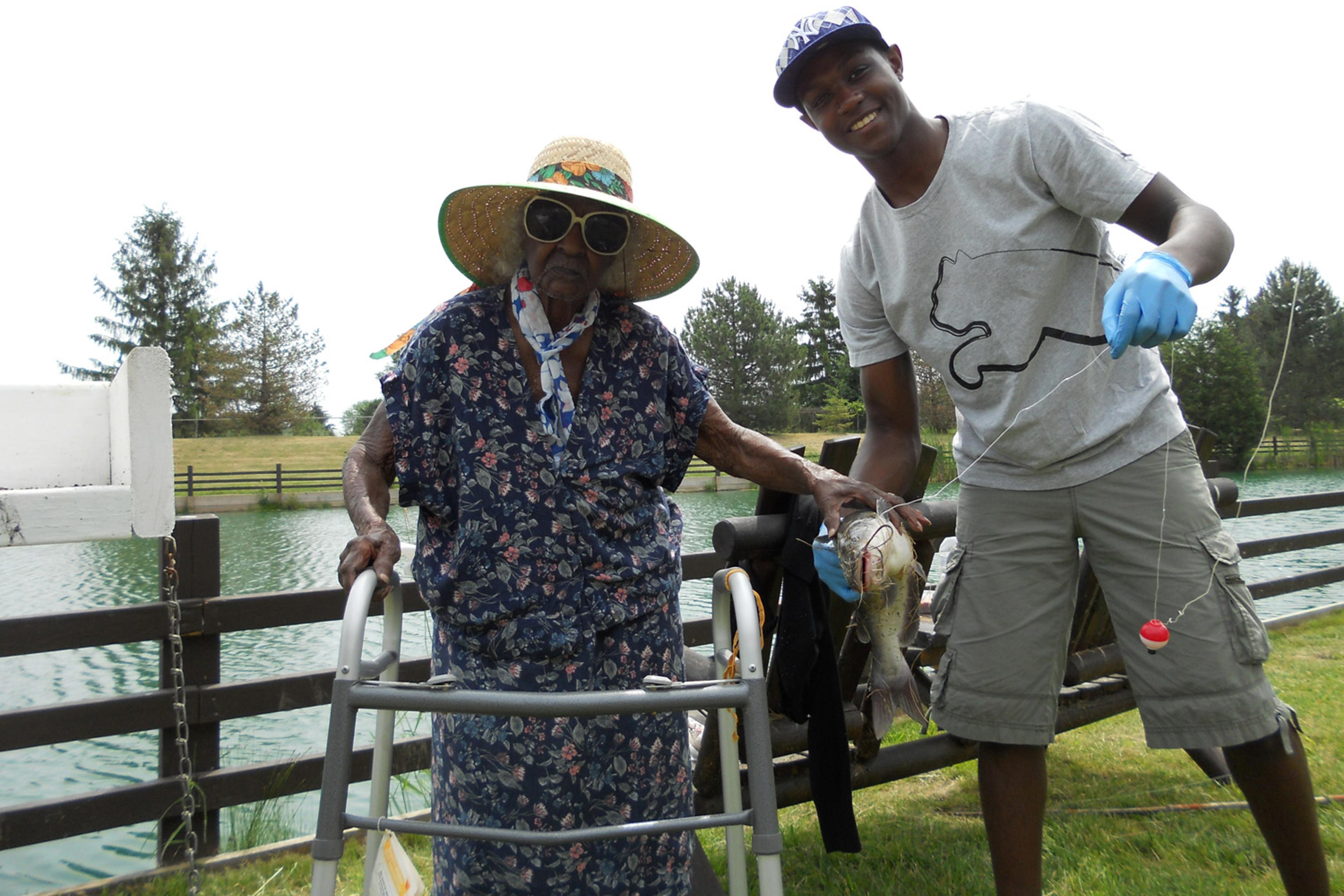 Jeralean Talley and godson Tyler Kinloch pictured with one of the seven catfish she caught at the Spring Valley Trout Farm in Dexter, Mich., on June 16, 2012.
