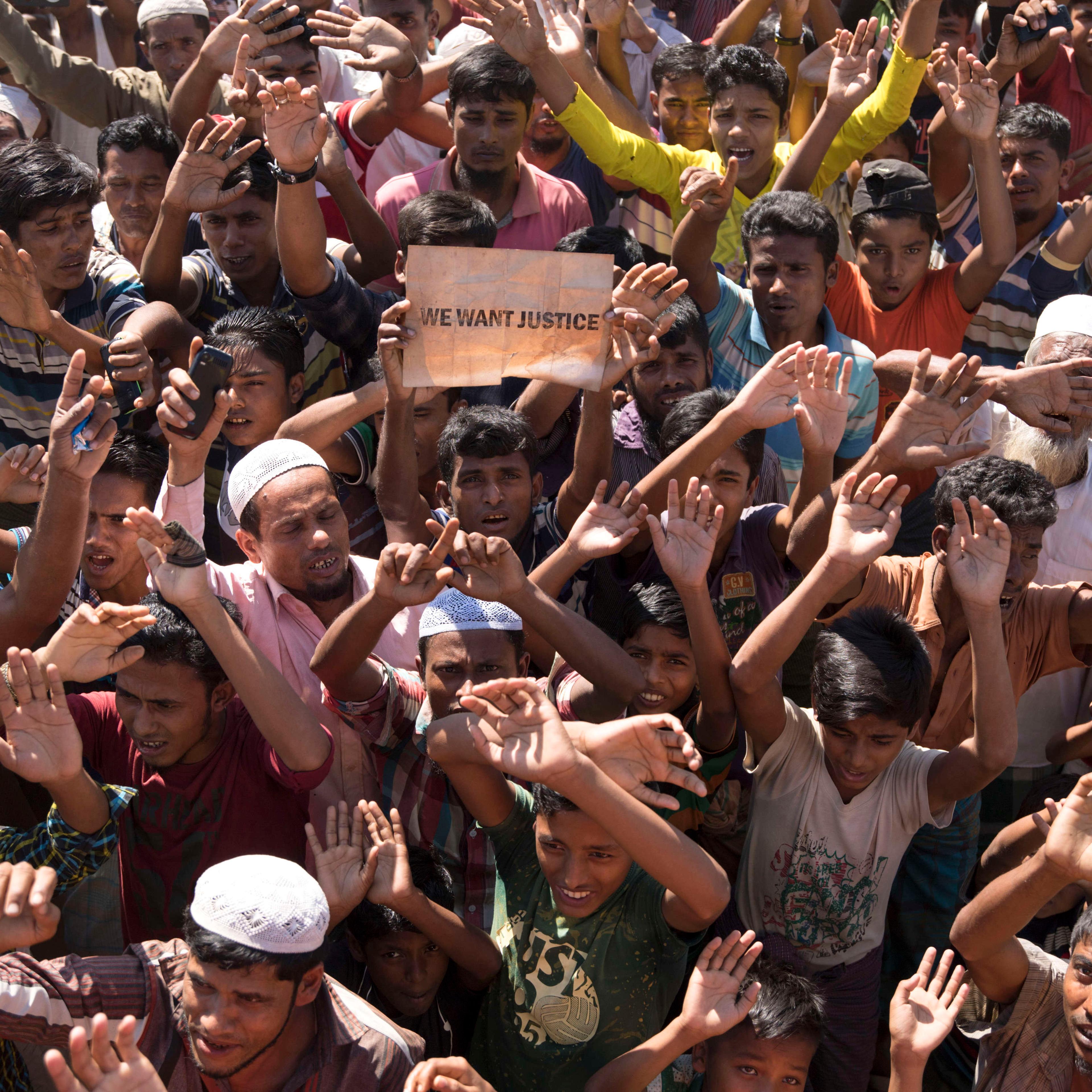 Rohingya people shouts slogans as they protest against the