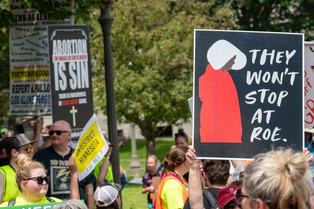 St. Paul, Minnesota. July 17, 2022.  Rally in support of legal abortion access after the U.S. Supreme court overturned the federal constitutional right to an abortion.  Anti and pro demonstraters hold up signs showing their different opinions.