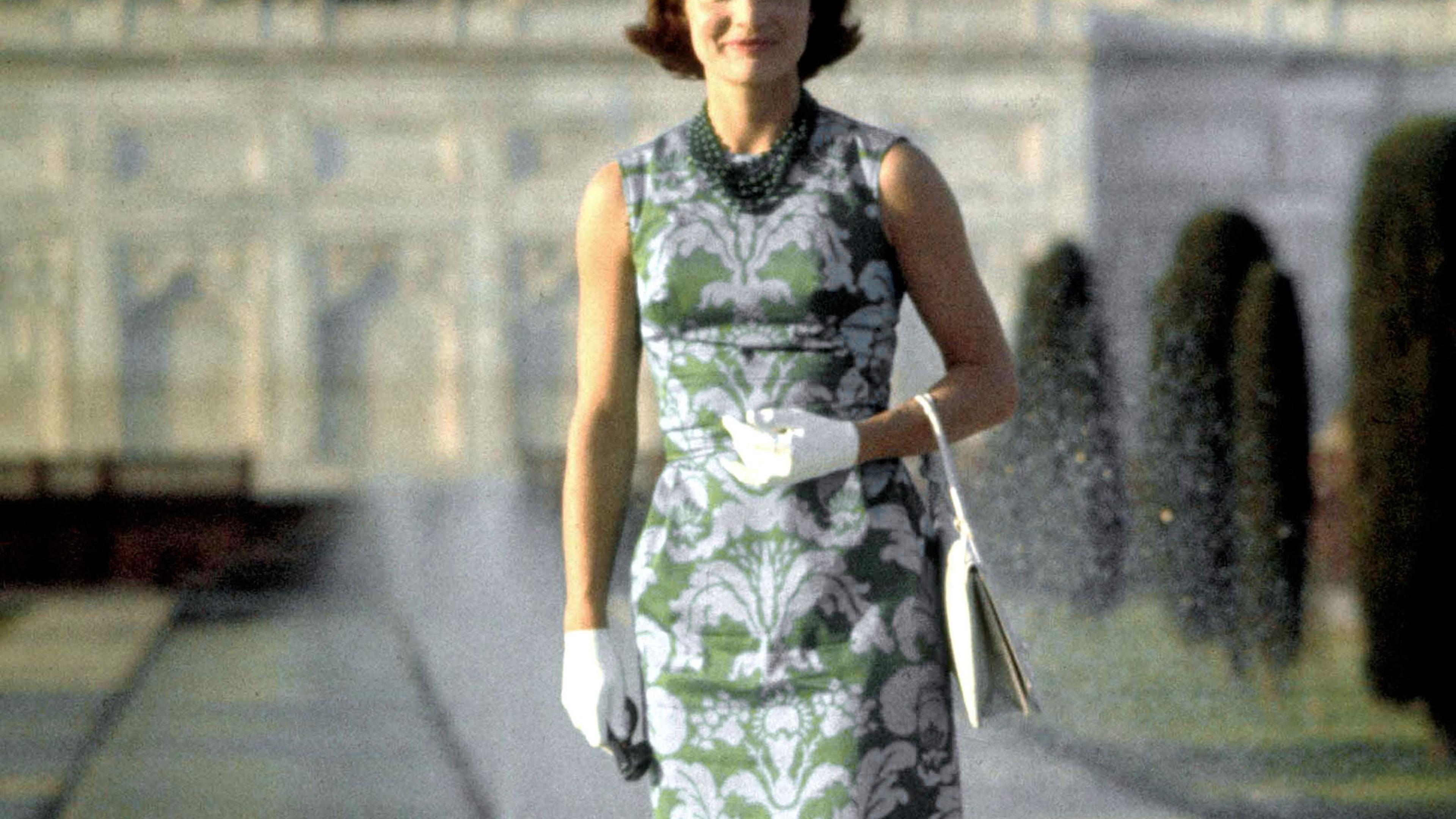 jackie kennedy green dress Jackie Kennedy and the Valentino green dress. Former US Madame First Lady, Jacqueline Kennedy Onassis, wore a custom Valentino green Grecian dress to a dinner hosted by Chamcar Mon Palace in her