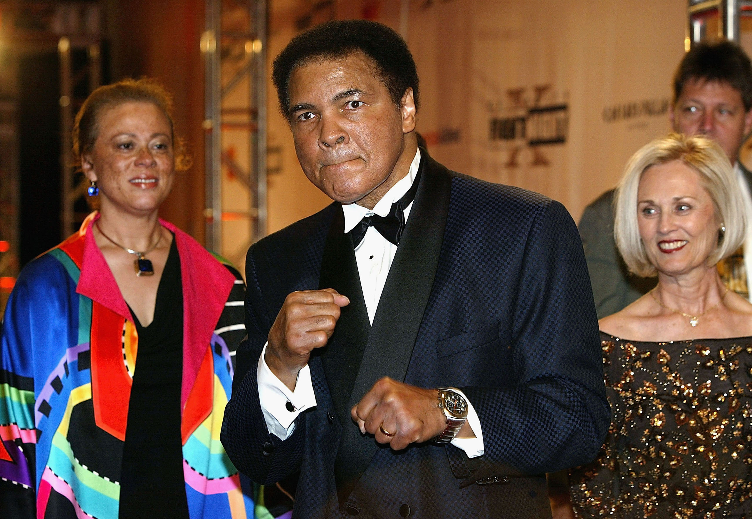 Muhammad Ali and wife Lonnie Ali arrive at 'Celebrity Fight Night X', a charity event to raise money for the Muhammad Ali Parkinson Research Center at Barrow Neurological Institute in Phoenix, Arizona on March 27, 2004.