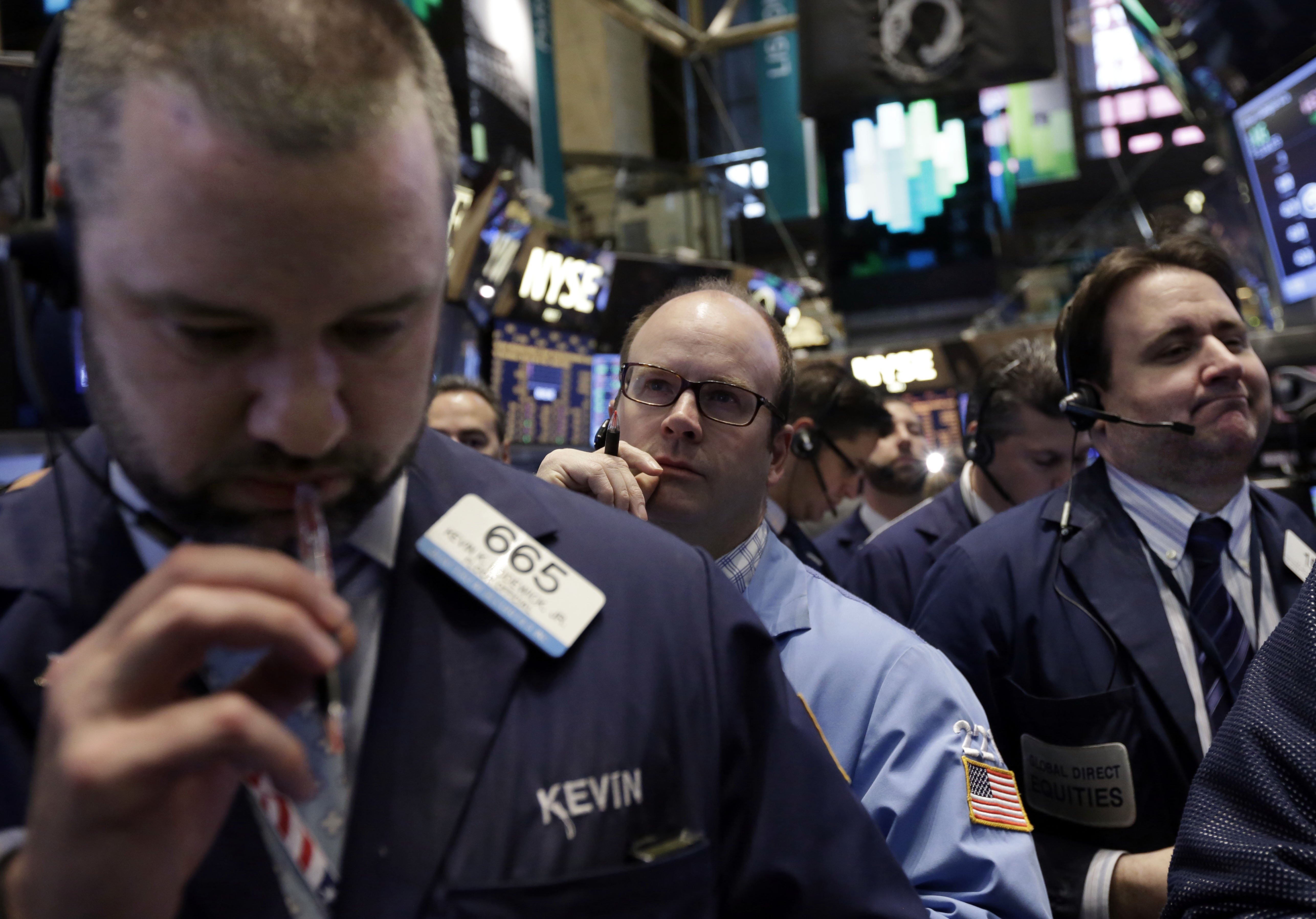 Traders work on the floor of the New York Stock Exchange
