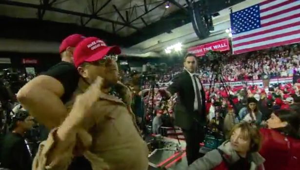 Footage captured by the BBC shows a member of the crowd at President Trump's rally in El Paso being led away after an assault on a cameraman.