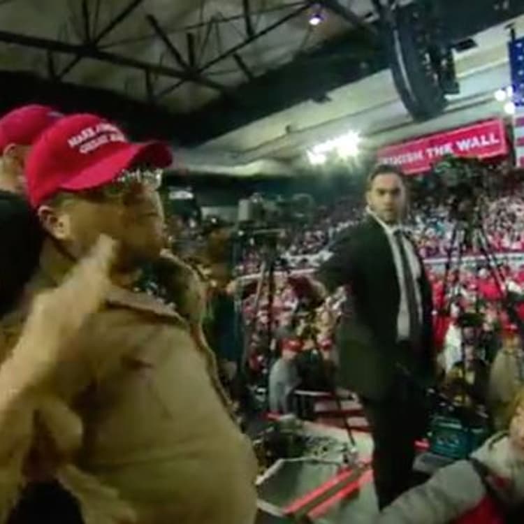 Footage captured by the BBC shows a member of the crowd at President Trump's rally in El Paso being led away after an assault on a cameraman.